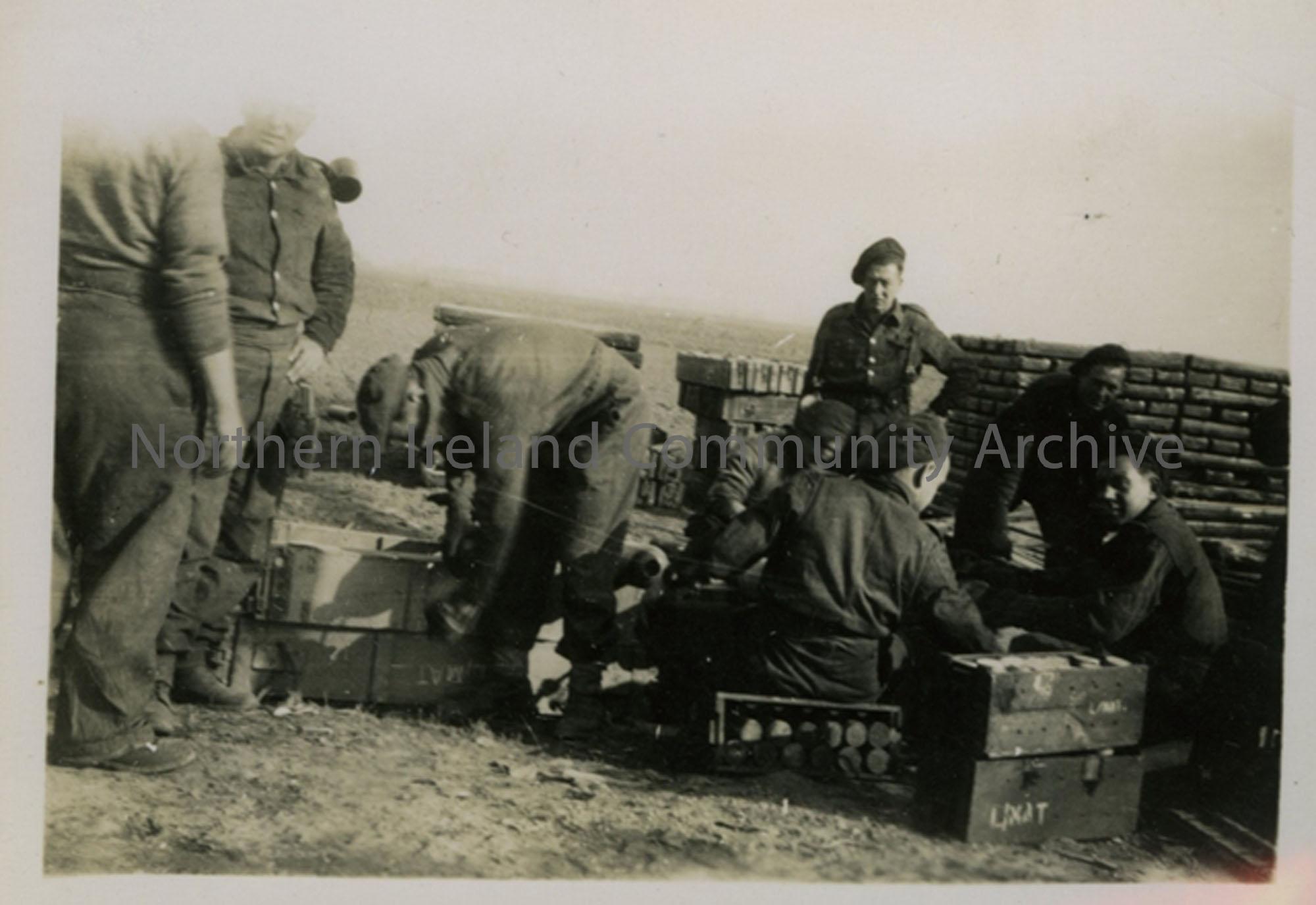 Group of soldiers with ammunition boxes