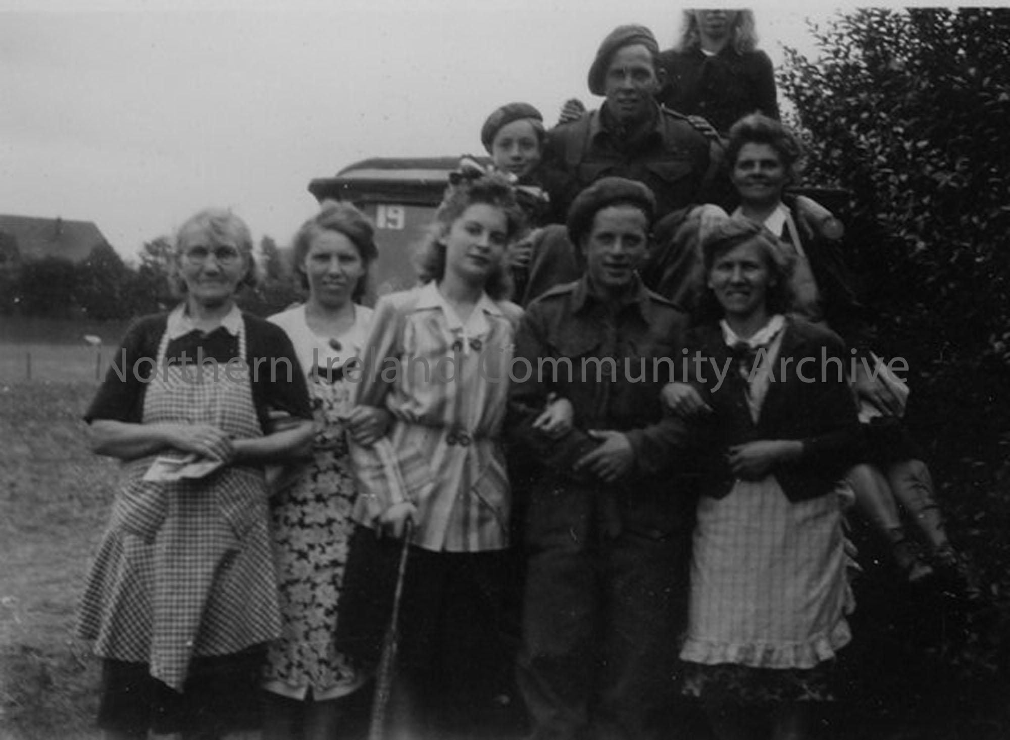 Group of soldiers, women and children