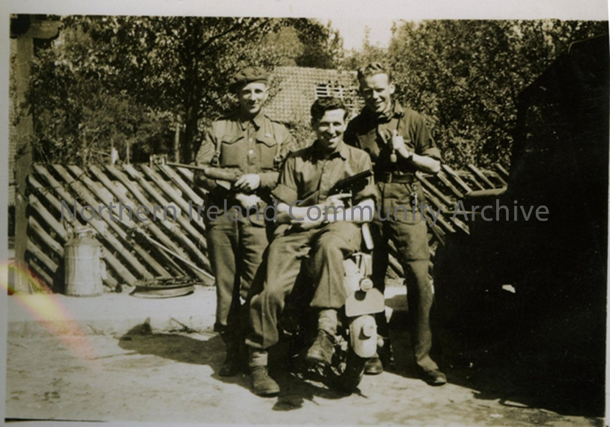 3 soldiers pictured outside