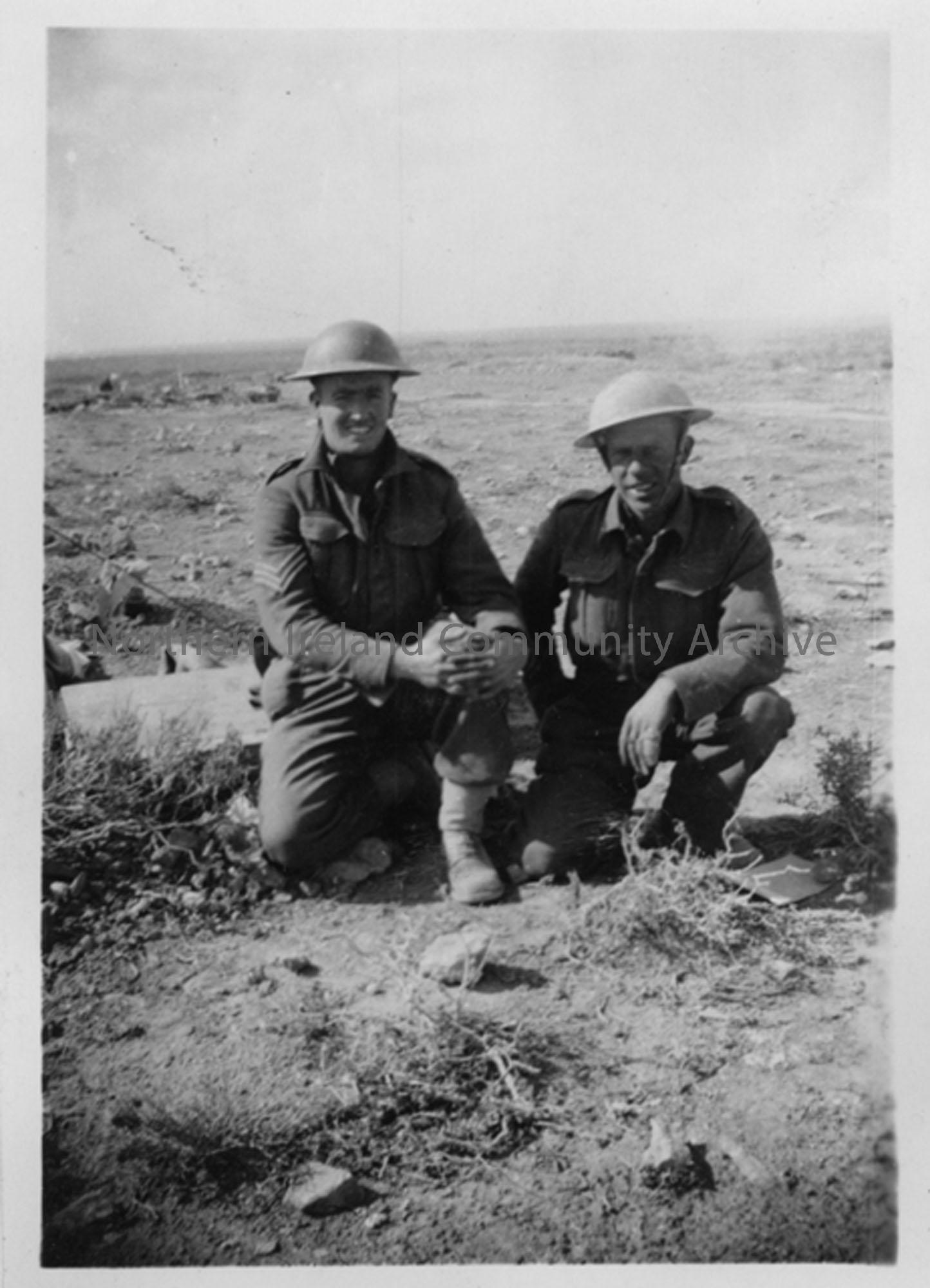 Sgt T McDonald and G Stewart kneeling in the desert