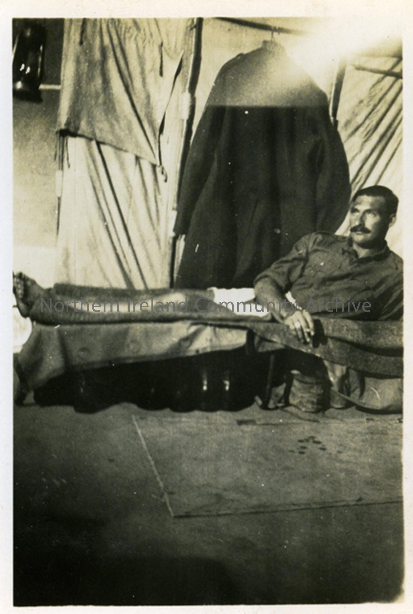 Soldier lying on a bed