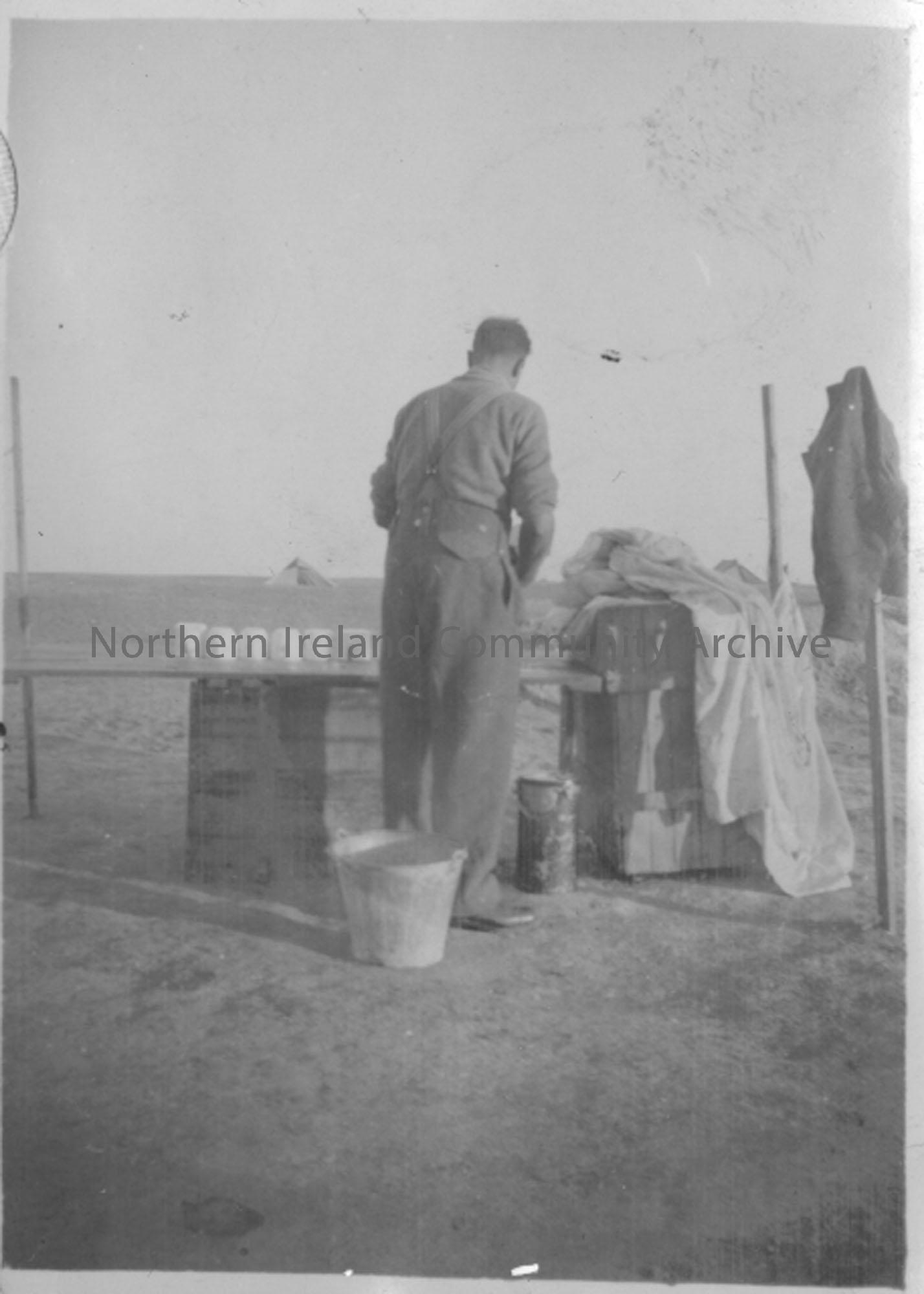 Picture of a Gunner washing cups