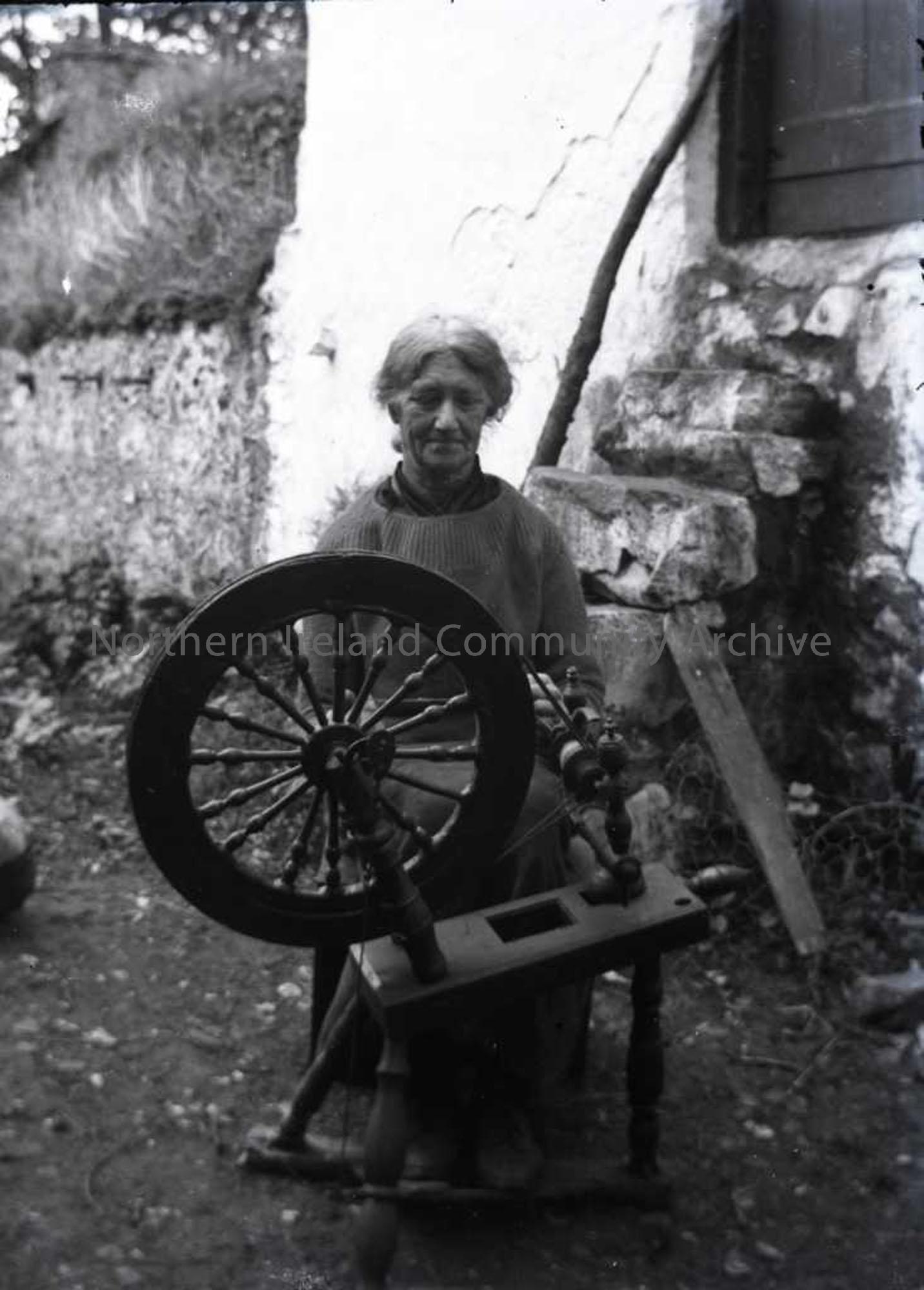 Lady working at spinning wheel