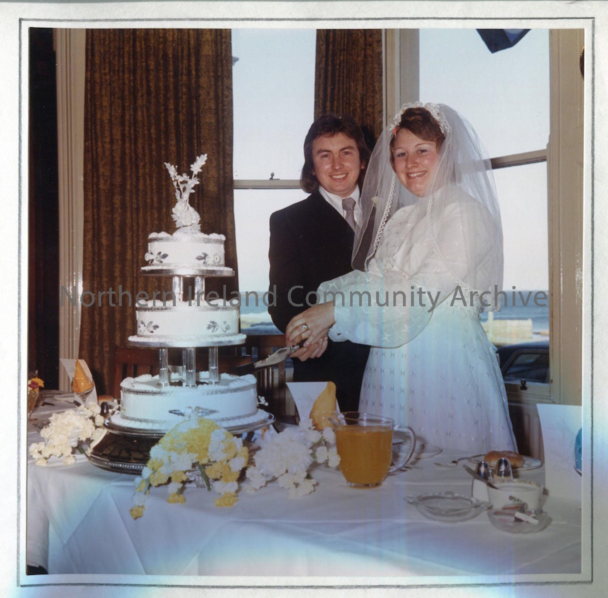 Anne and Philip Kennedy cut their wedding cake