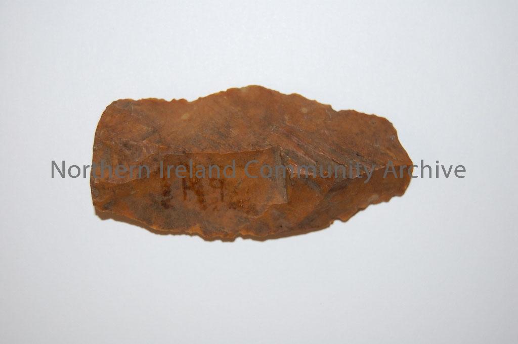 arrowhead, yellow brown flint, long triangular shape, broken tip – 1997.31 (2)
