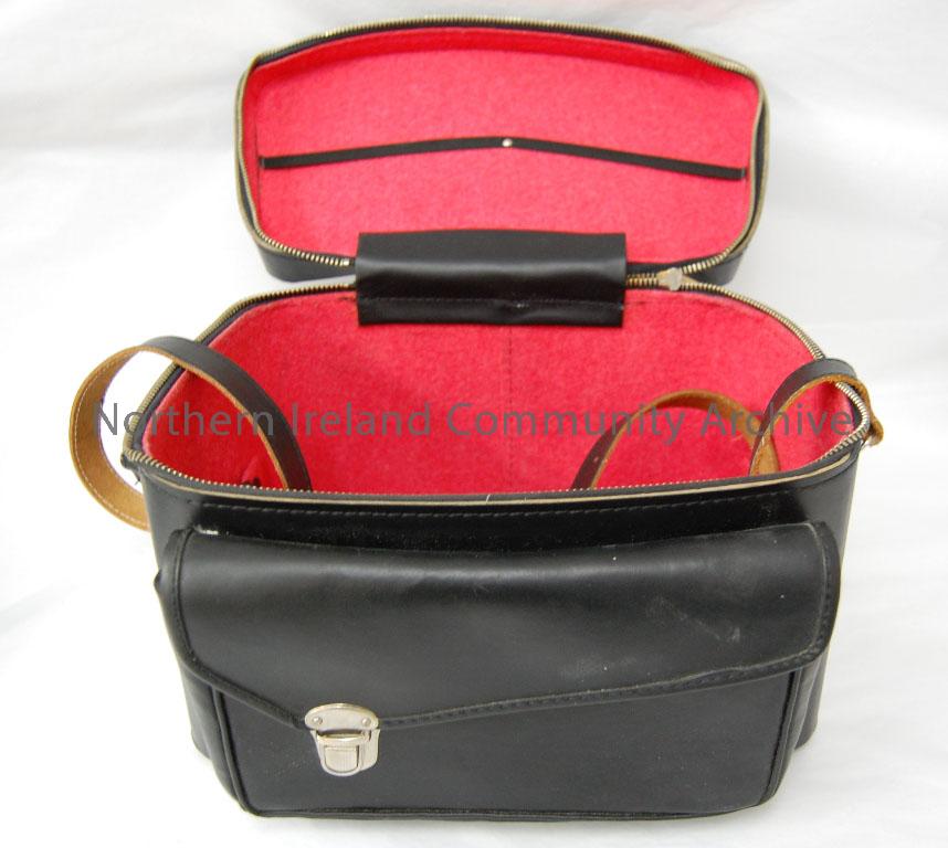 camera case for Ilford Elmo cine camera. Black plastic, with red felt interior. Zip fastened. Separte compartment on front. – 2006.200.8 (1)