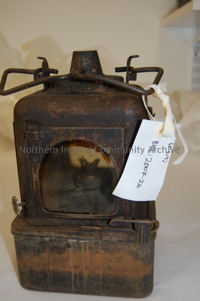 four sided paraffin lamp, with glass intact. Complete, blackened/tarnished by use. Requires restoration. – 2007.24 (1)