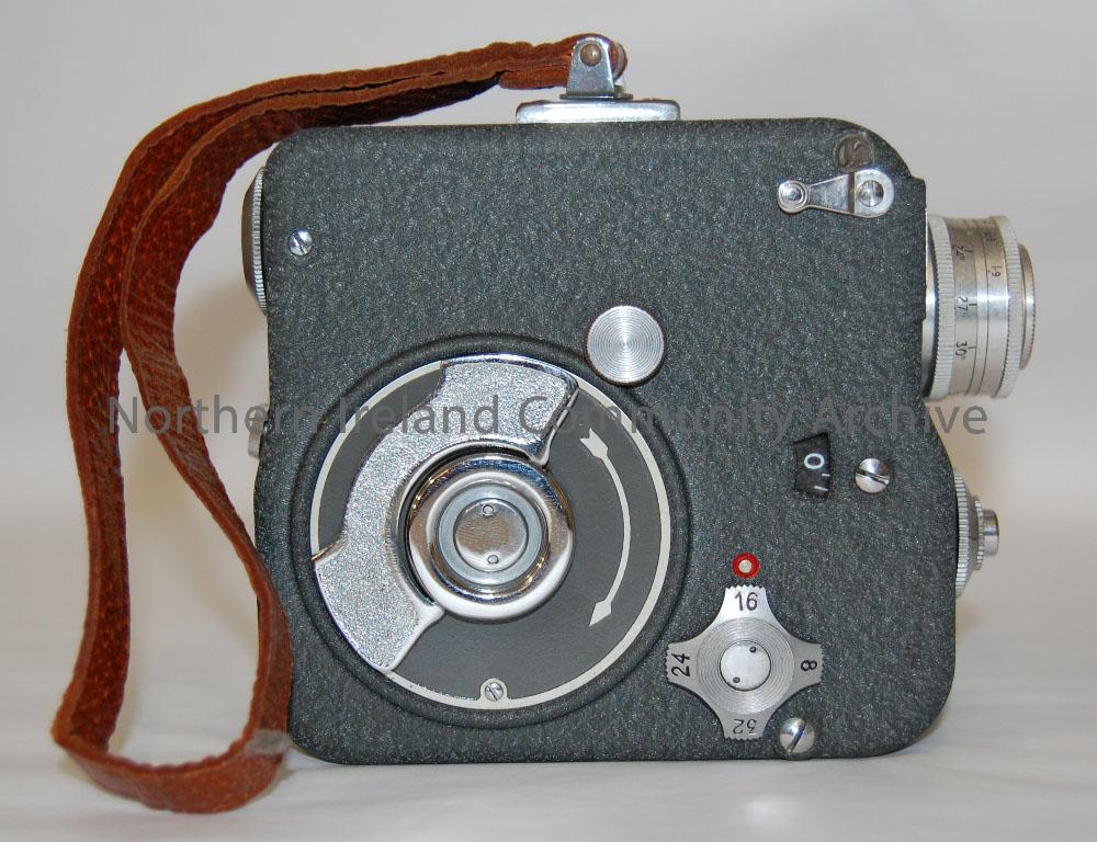 Pathe 9.5mm camera. Grey metal camera body with brown leather bag. Made in France. – 2010.380 (3)