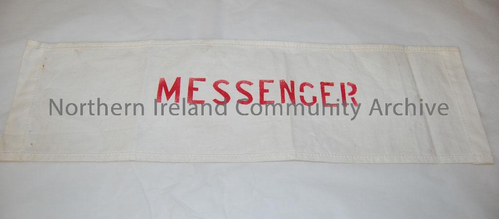Civil Defence arm bands. One is navy and yellow and has Civil Defence on it, two are white with the word messenger in red and one is white with the wo… – 2010.597 (2)