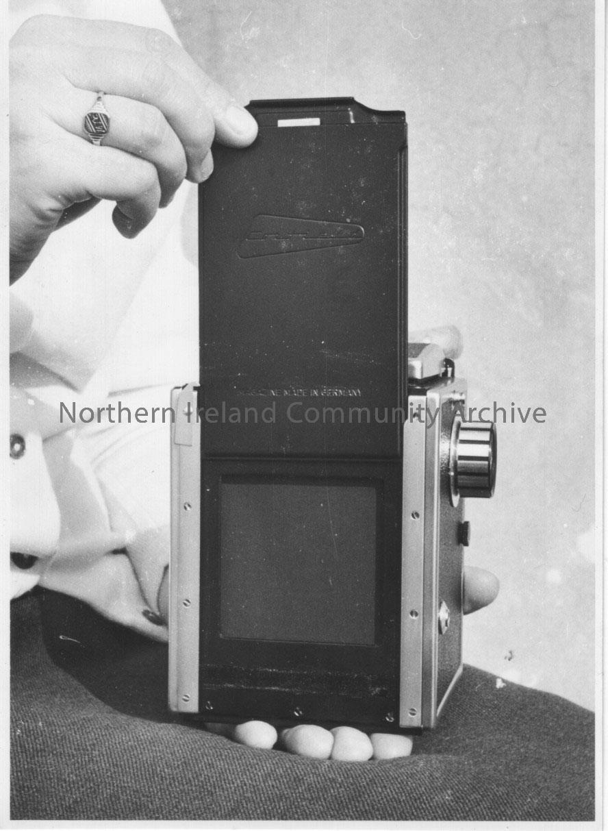 Photographs of a Corfield 66 camera modelled by Pat Williams. – 2011.265 (8)