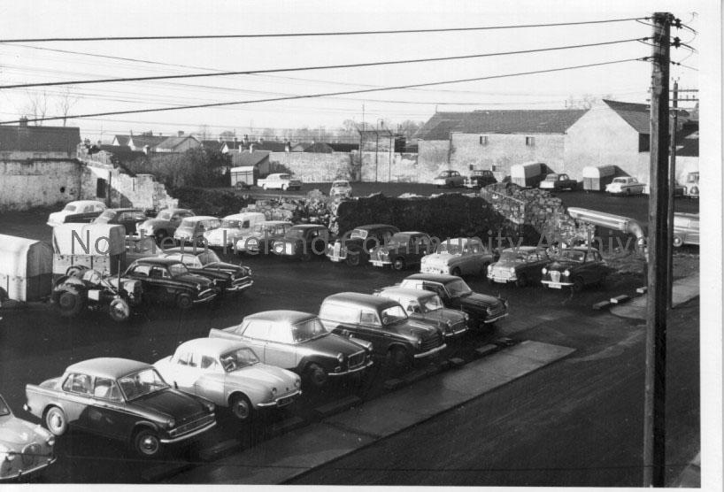 black and white photographs depicting terraced houese, backyards, carparks, come scenes of dilapidation C. 1950’s. Handwritten note included indicates… – 2011.387 (6)