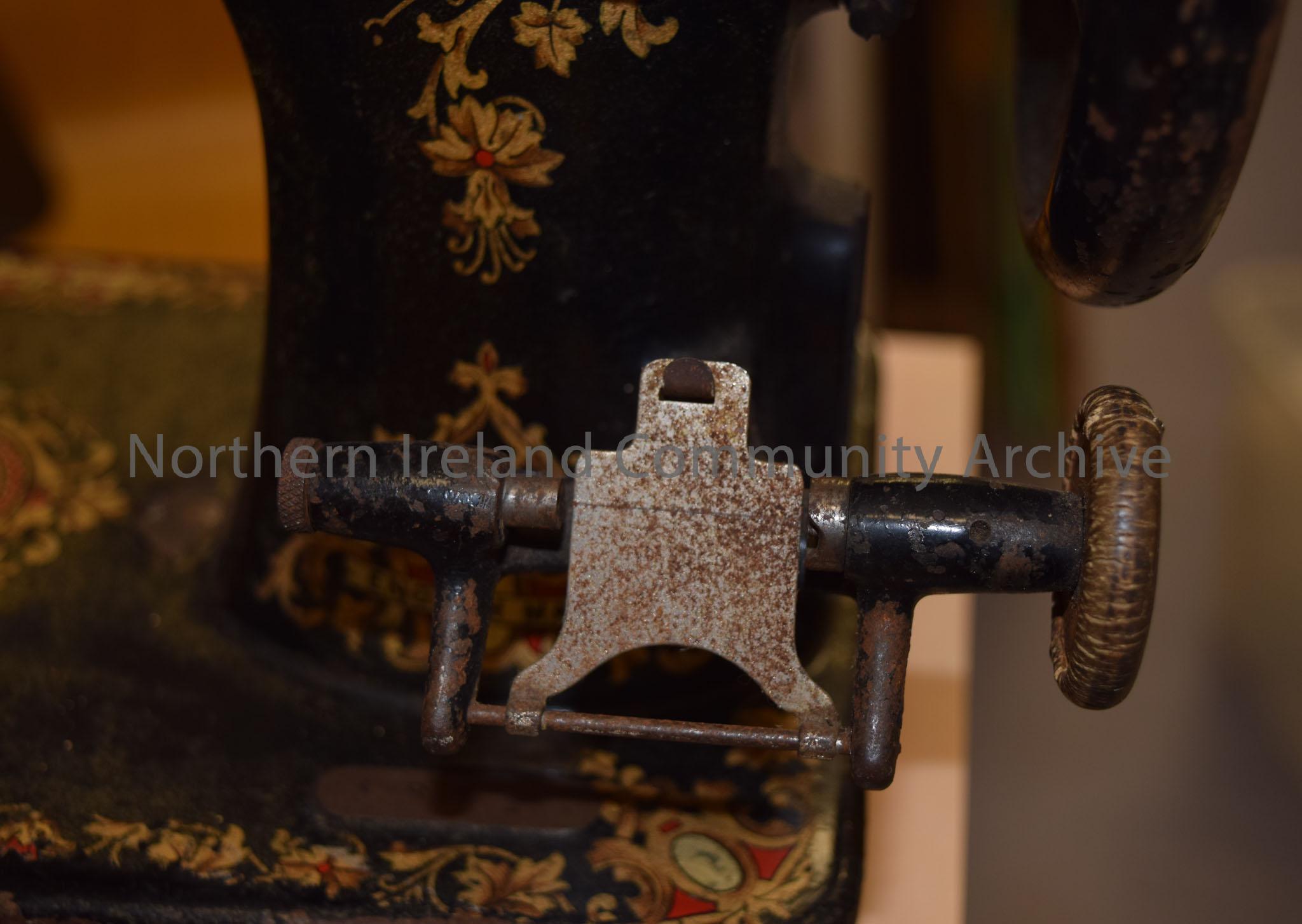 Black Family C.S Jones sewing machine with gold, yellow and red leaf decoration. Top part of a treadle sewing machine. – 2014.178 (3)