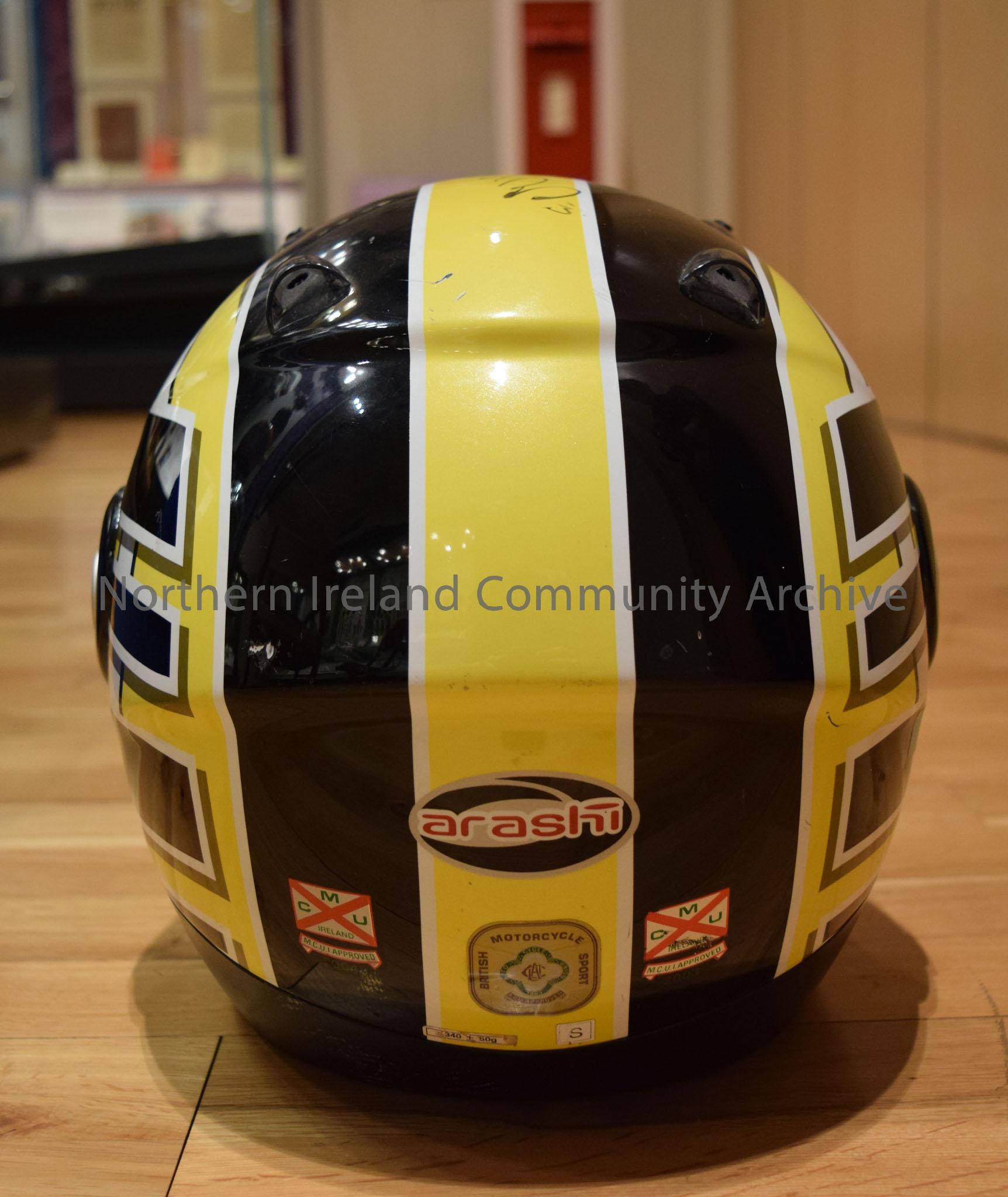 Arashi motorcycle helmet belonging to Michael Dunlop. Black, yellow and white striped helmet. – 2016.110 (4)