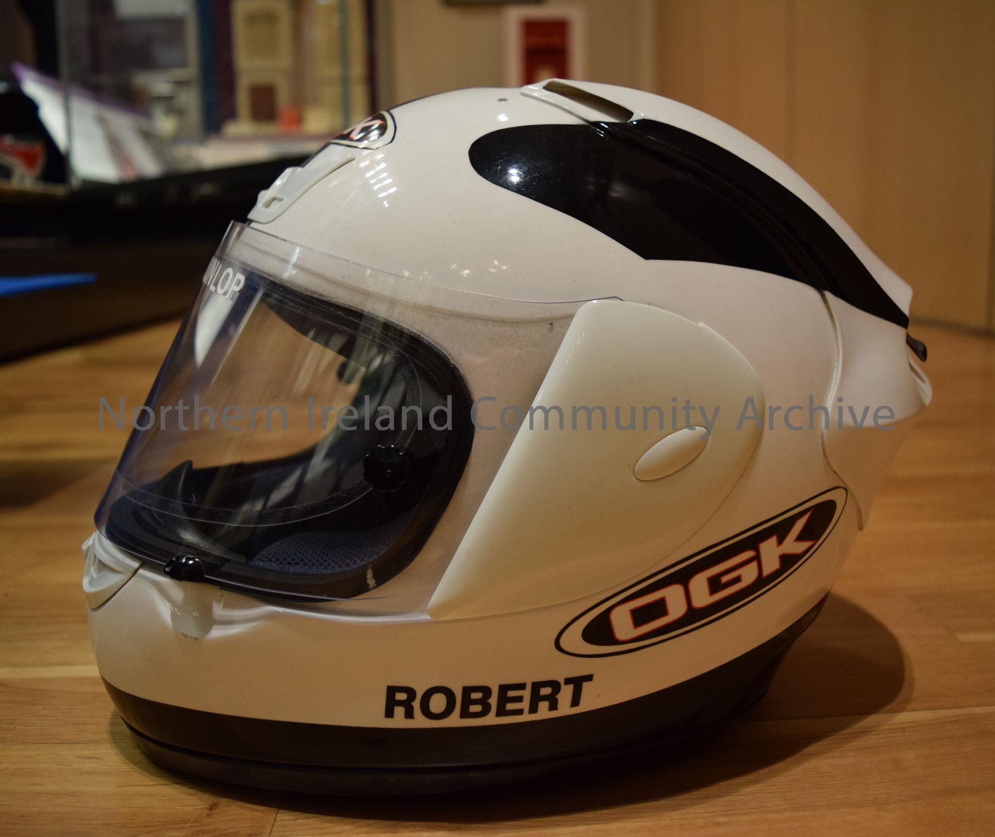 OGK motorcycle helmet belonging to Robert Dunlop. White helmet with a