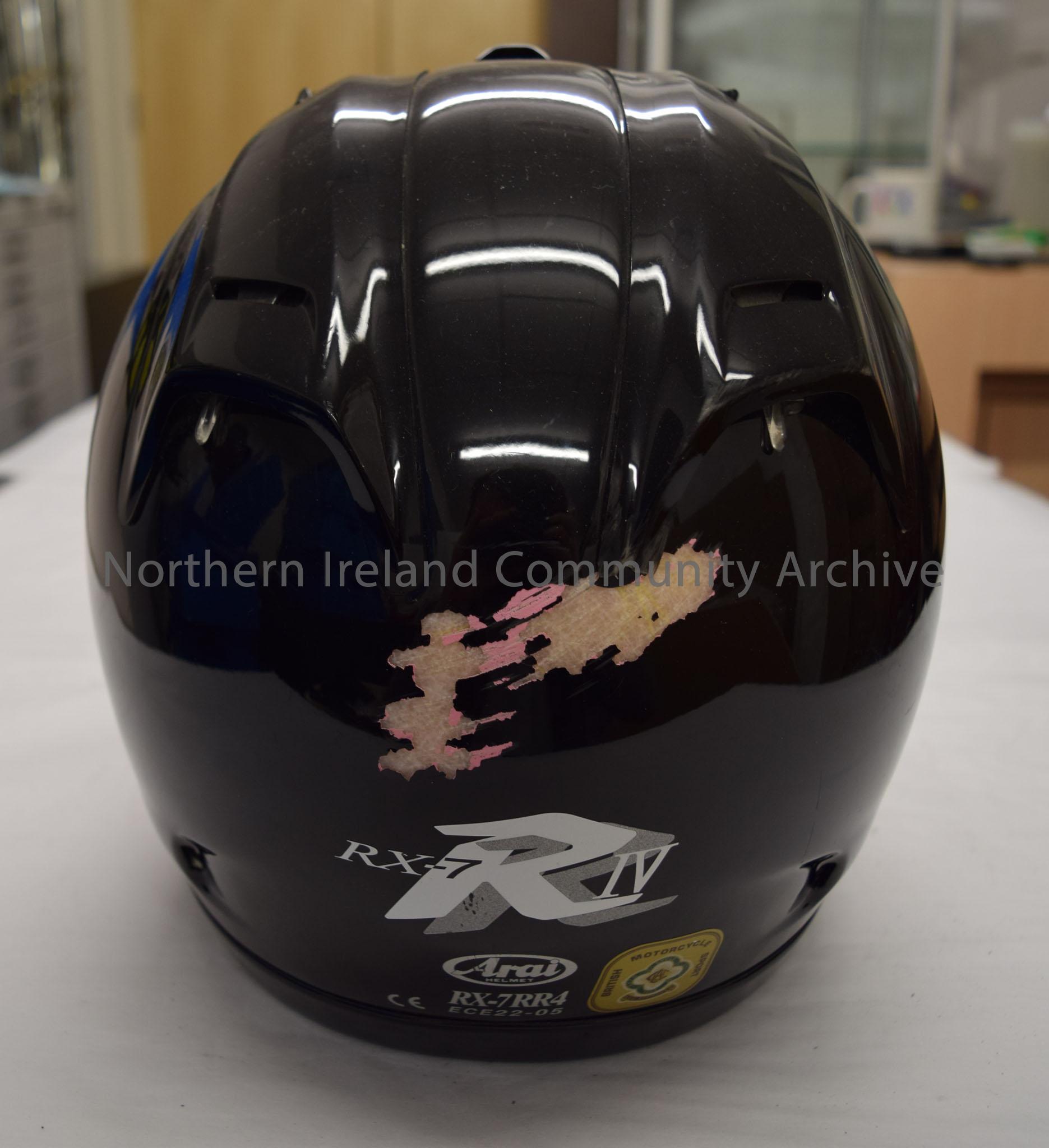Arai motorcycle helmet belonging to Gary Jackson. Black helmet with yellow visor hinge covers. – 2016.37 (4)