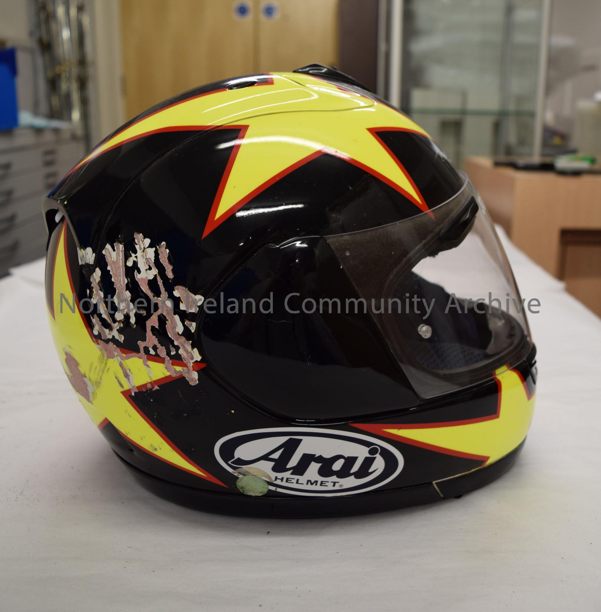 Arai motorcycle helmet belonging to John Donnan. Black helmet with yellow stars with a red border on it (two on the chin bar, two on the top and two o… – 2016.60 (5)