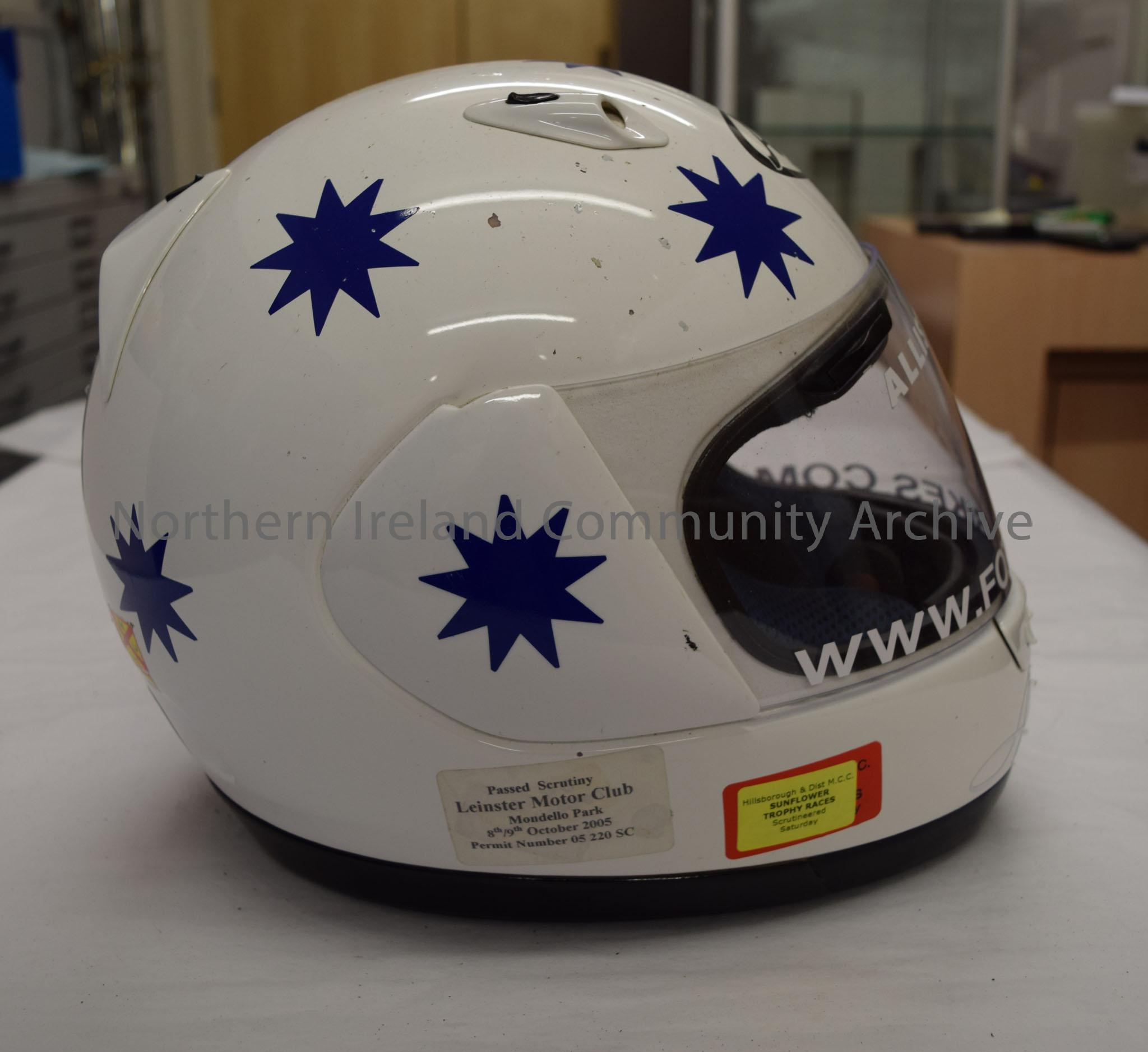 Arai motorcycle helmet belonging to Alastair Seeley. White helmet covered in blue stars. – 2016.91 (5)