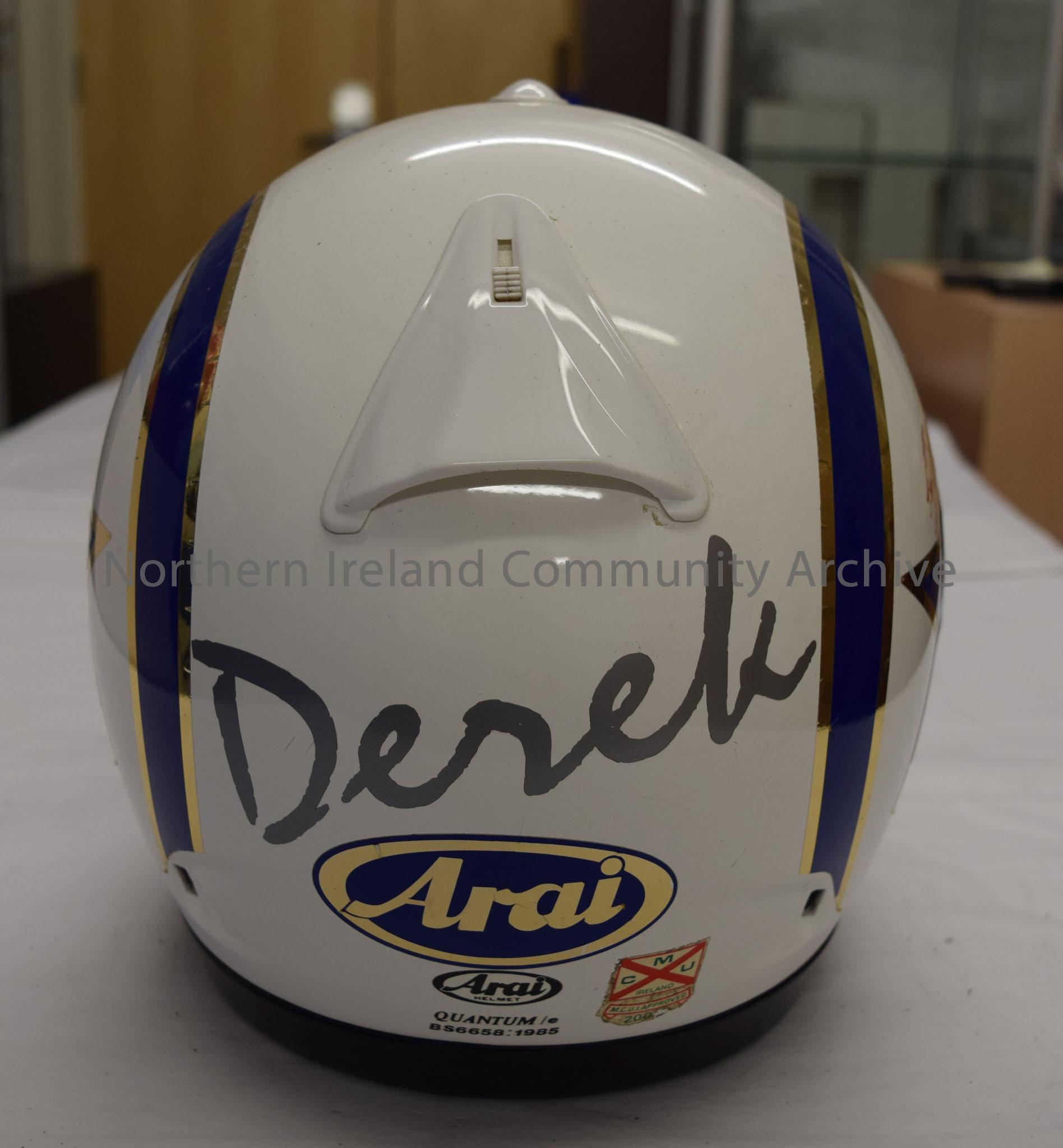 Arai motorcycle helmet belonging to Derek McLaughlin. White with blue and reflective silver stripes down each side and blue and reflective silver star… – 2016.94 (4)