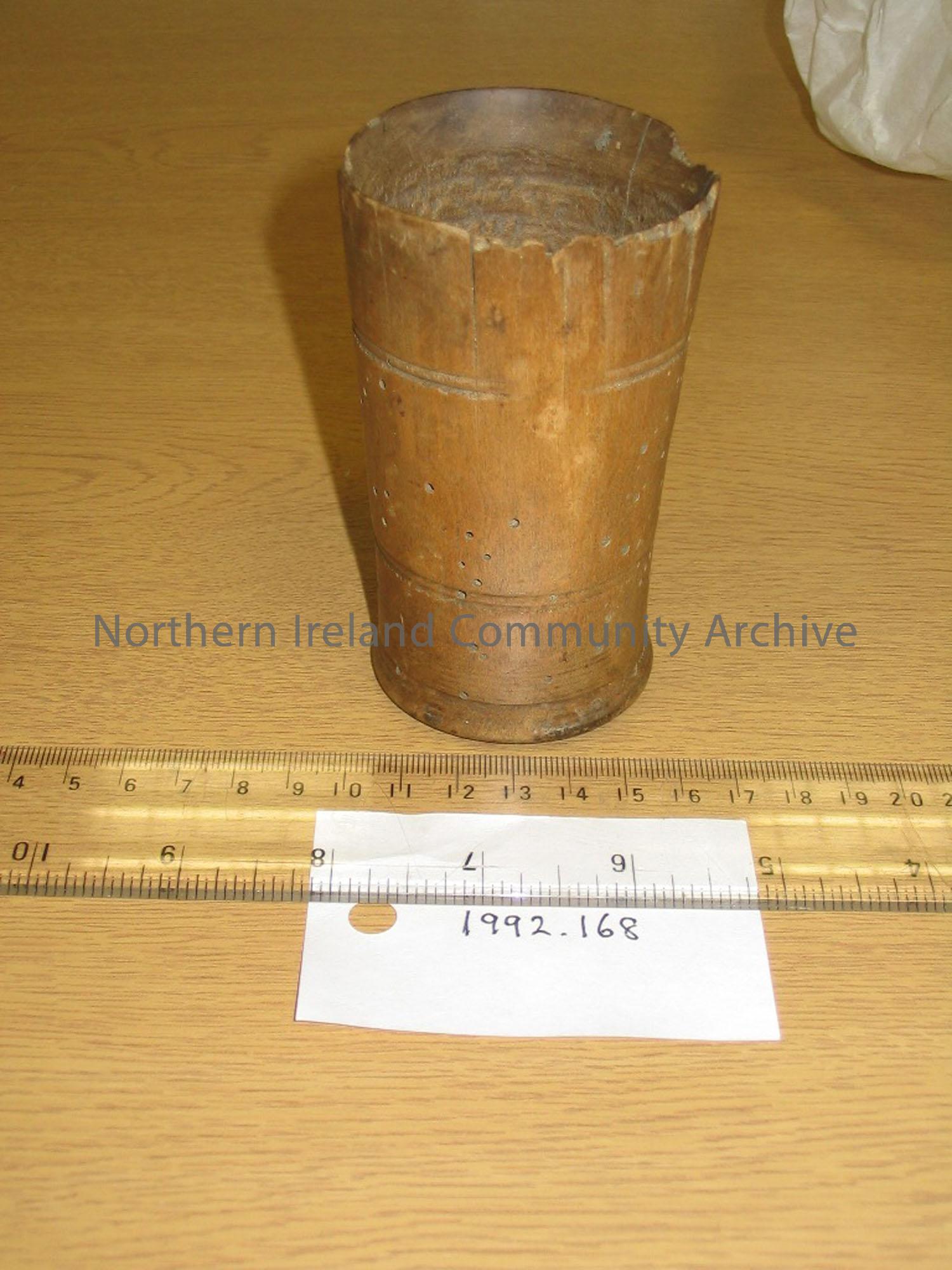 wooden goblet, lip of vessel chipped and evidence of wood worm.