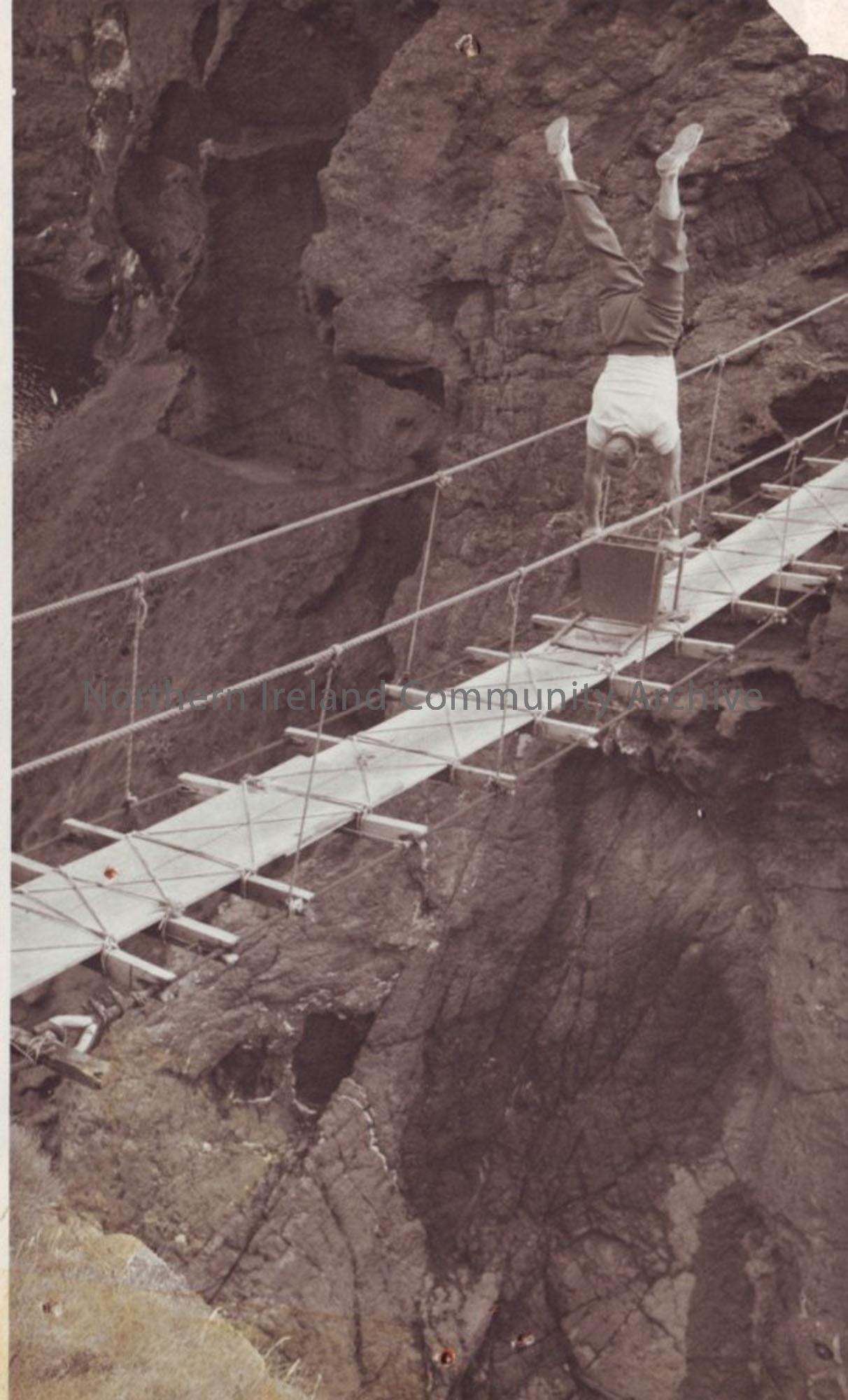 Leslie McCurdy, Athlete balancing on a chair on Carrick-a-Rede rope-bridge
