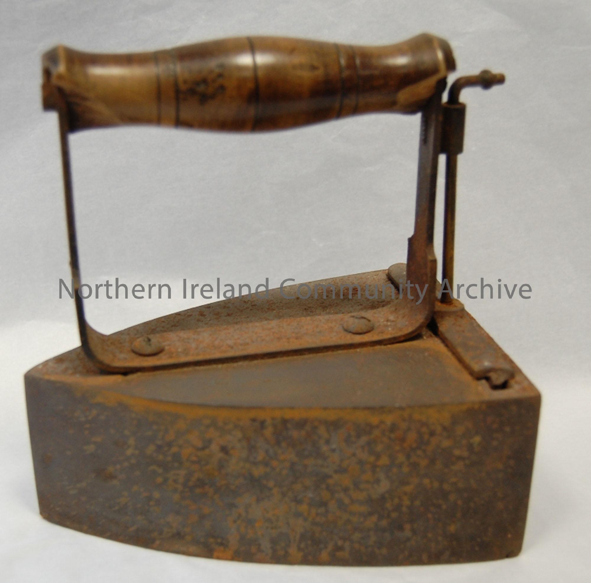 Box iron which used metal slugs heated in stove and put inside the iron. See BHC:1998.14,15 for slugs. Owned by Mrs Rebecca Coleman, Bendooragh Rd