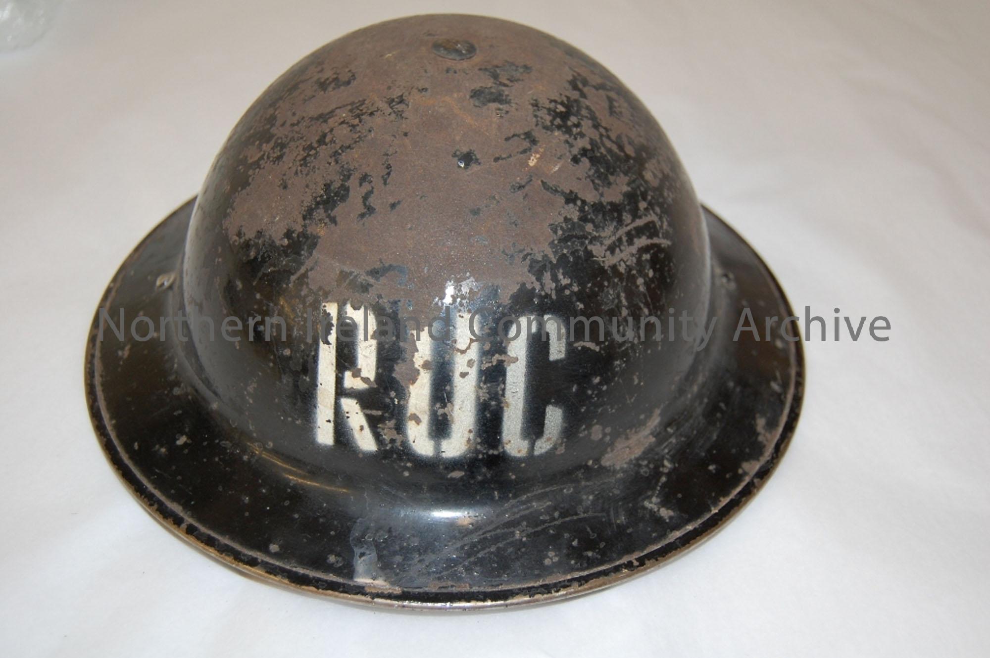 RUC circa 1940’s; Black with the letters ‘RUC’ painted on front. Inner padding still intact with strap. Some of black paint chipped off. See BHC:1998….