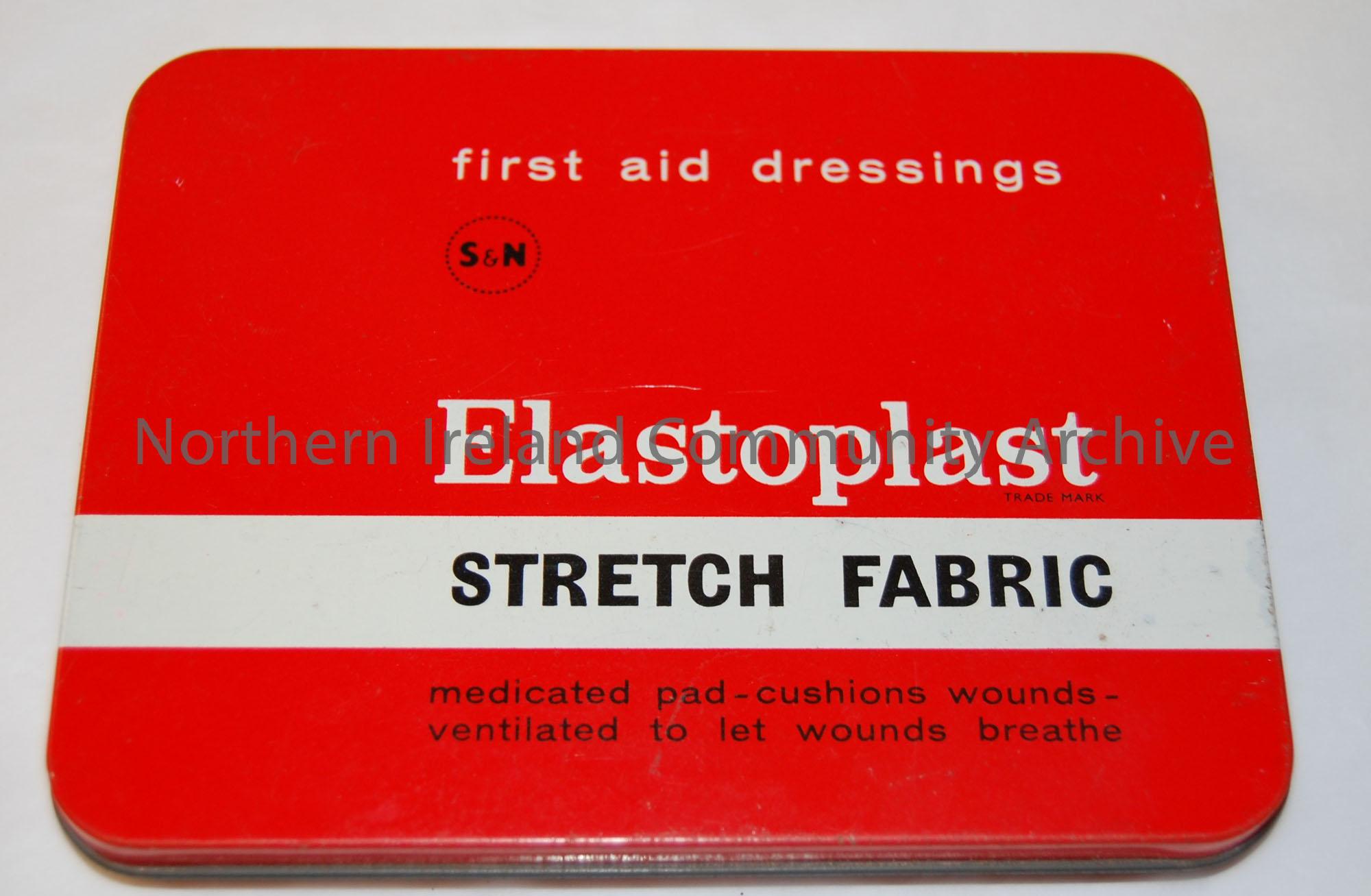 ‘First aid dressings/Elastoplast/Stretch Fabric..’. Thin flat tin container for plasters. Red background, with black and white print. c.1960s