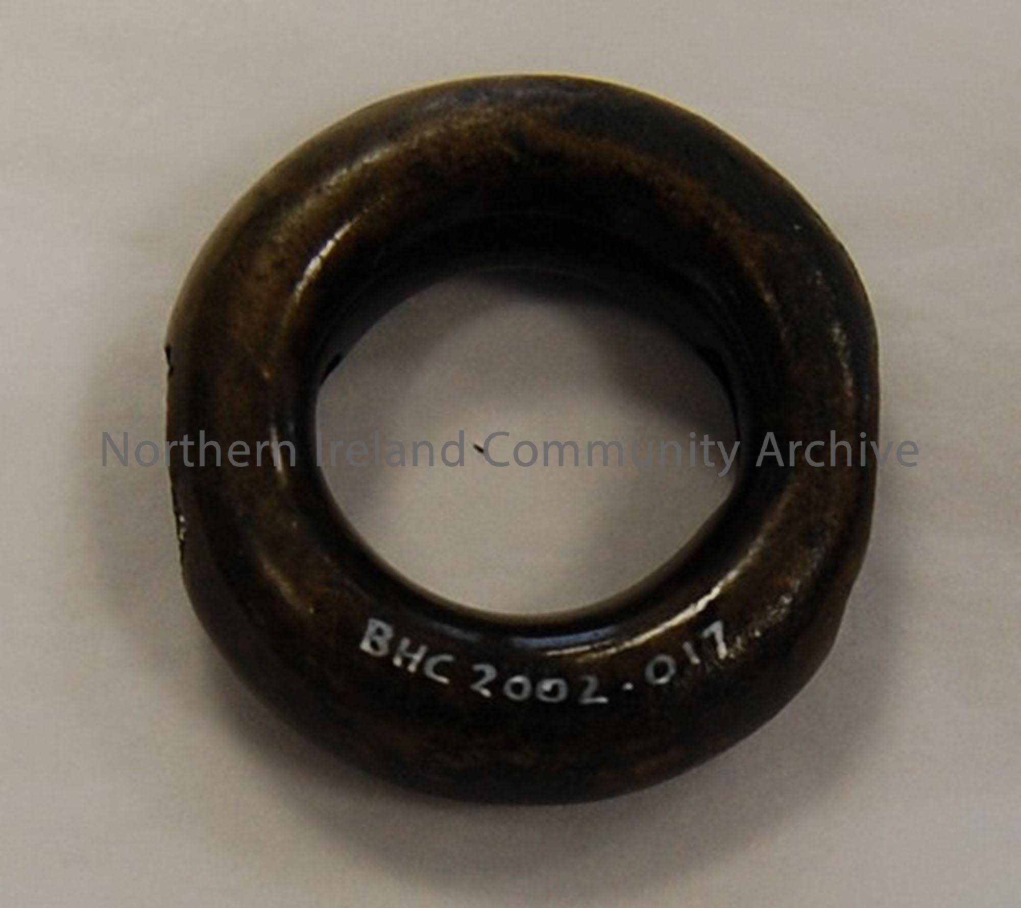 Bronze age ring, hollow with opposite holes.