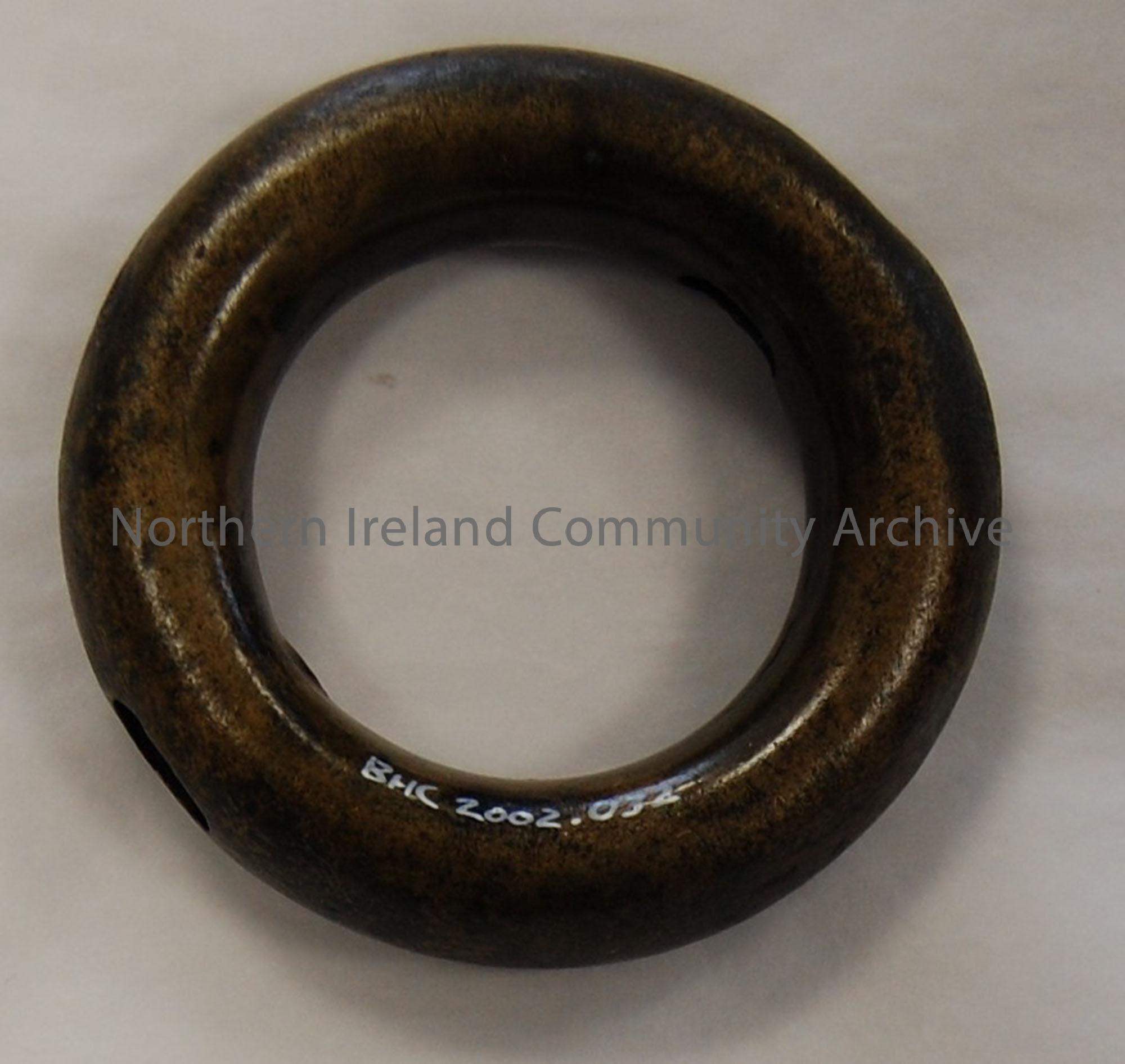 Bronze Age ring, hollow, opposite holes.
