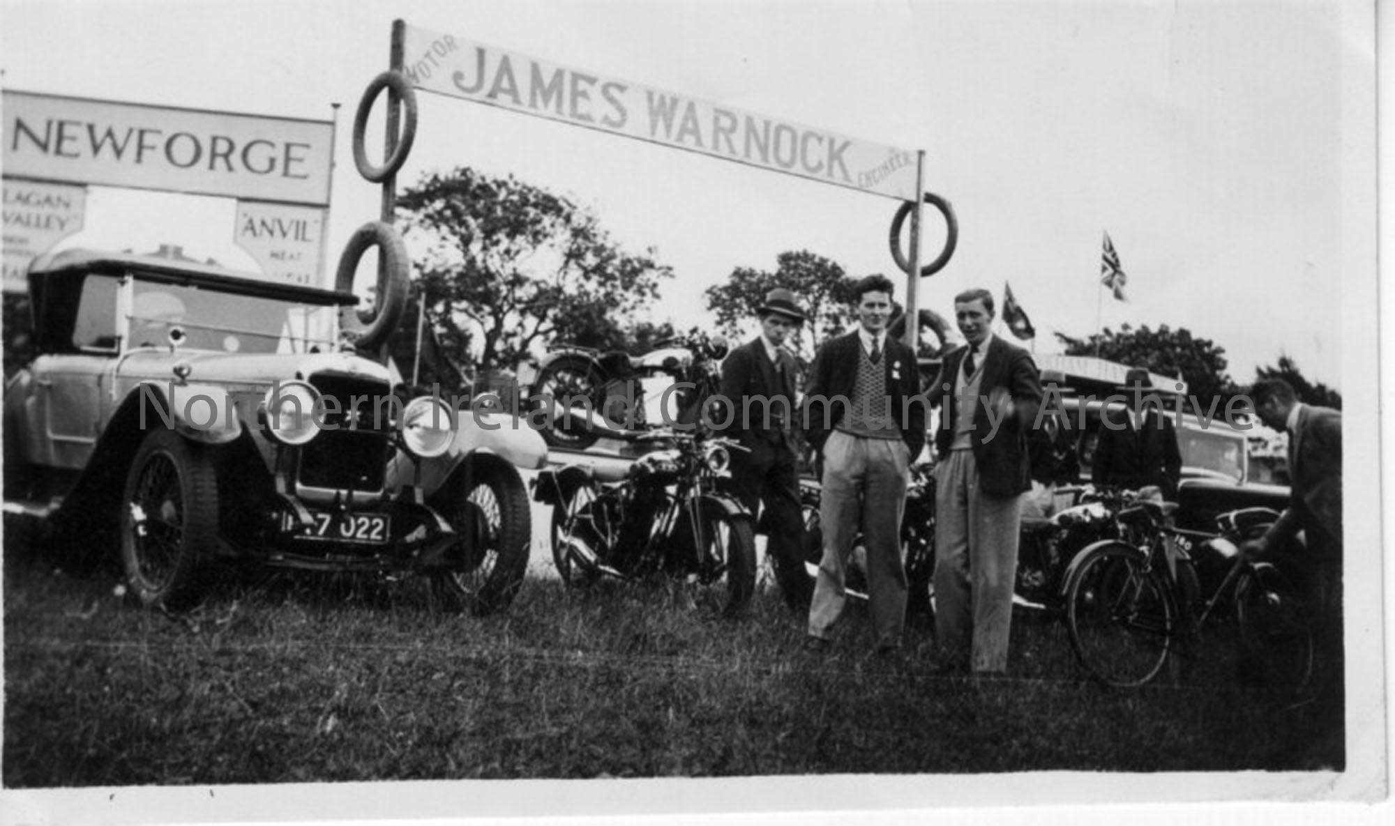 James Warnock’s Motor Vehicle stand. Donor’s father stands in centre with two other men