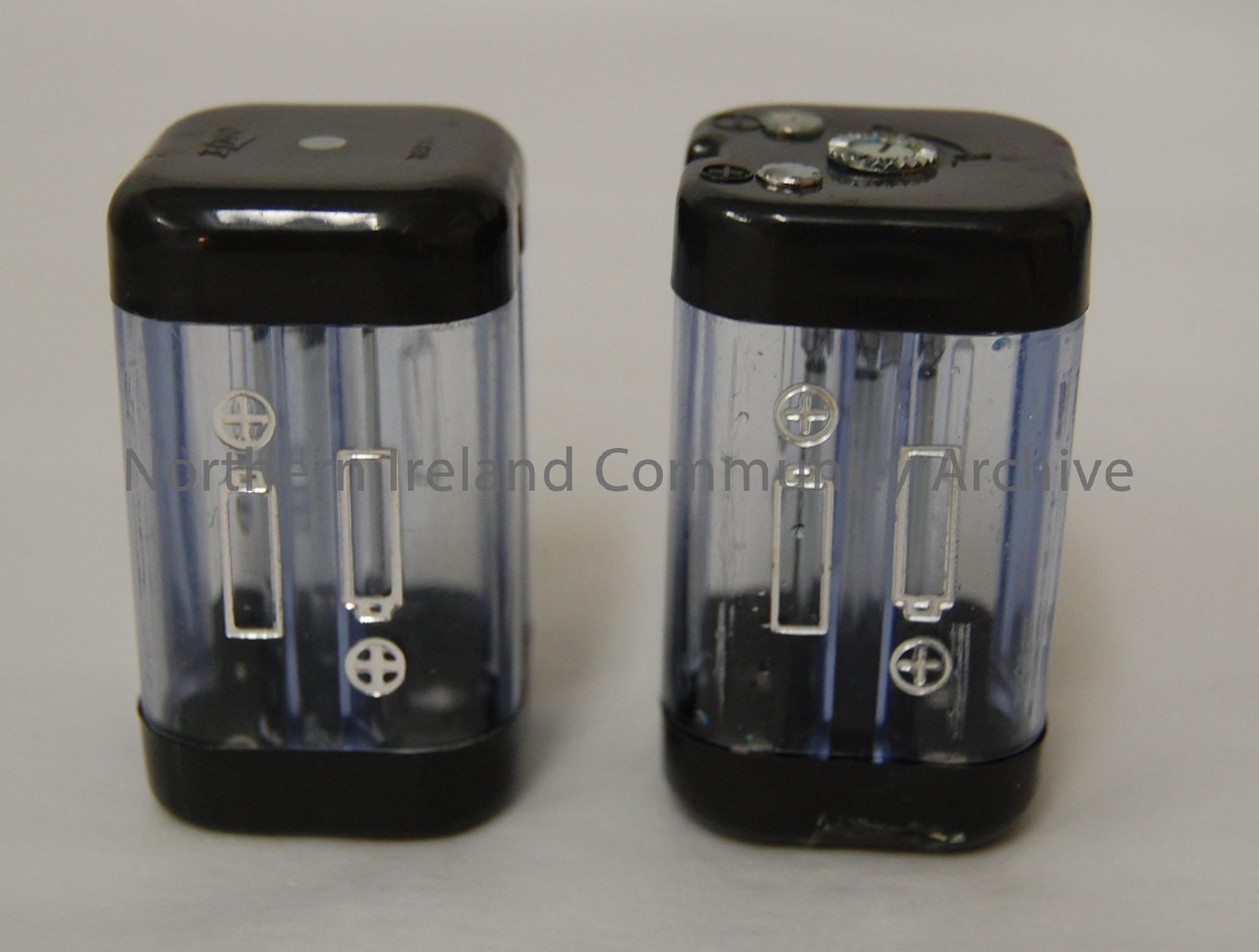 Elmo Battery cases. Takes four batteries, clear plastic, with black plastic at either end