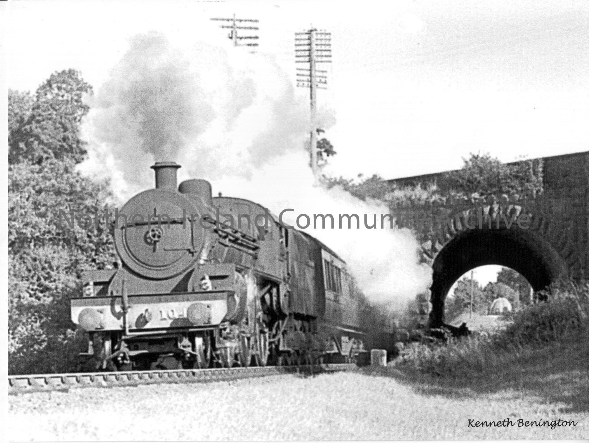 W class 2-6-0 No.104 travels under the main Ballymoney to Ballymena road at the Dry Arch with an early morning Derry to Belfast express