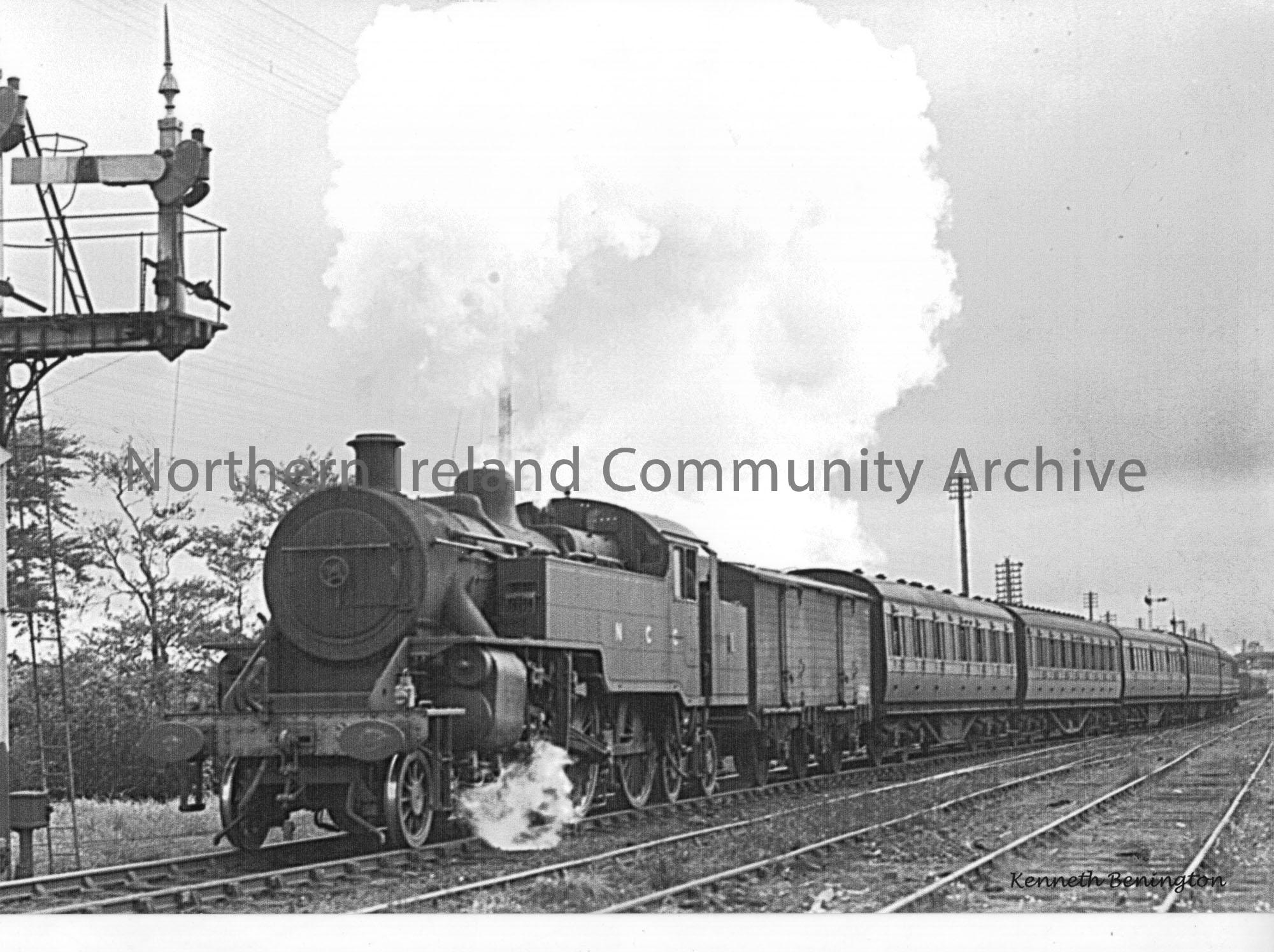 WT class 2-6-4T No.2 leaves Ballymoney with a stopping train for Belfast York Road, with a 6-wheeled van next to the engine.