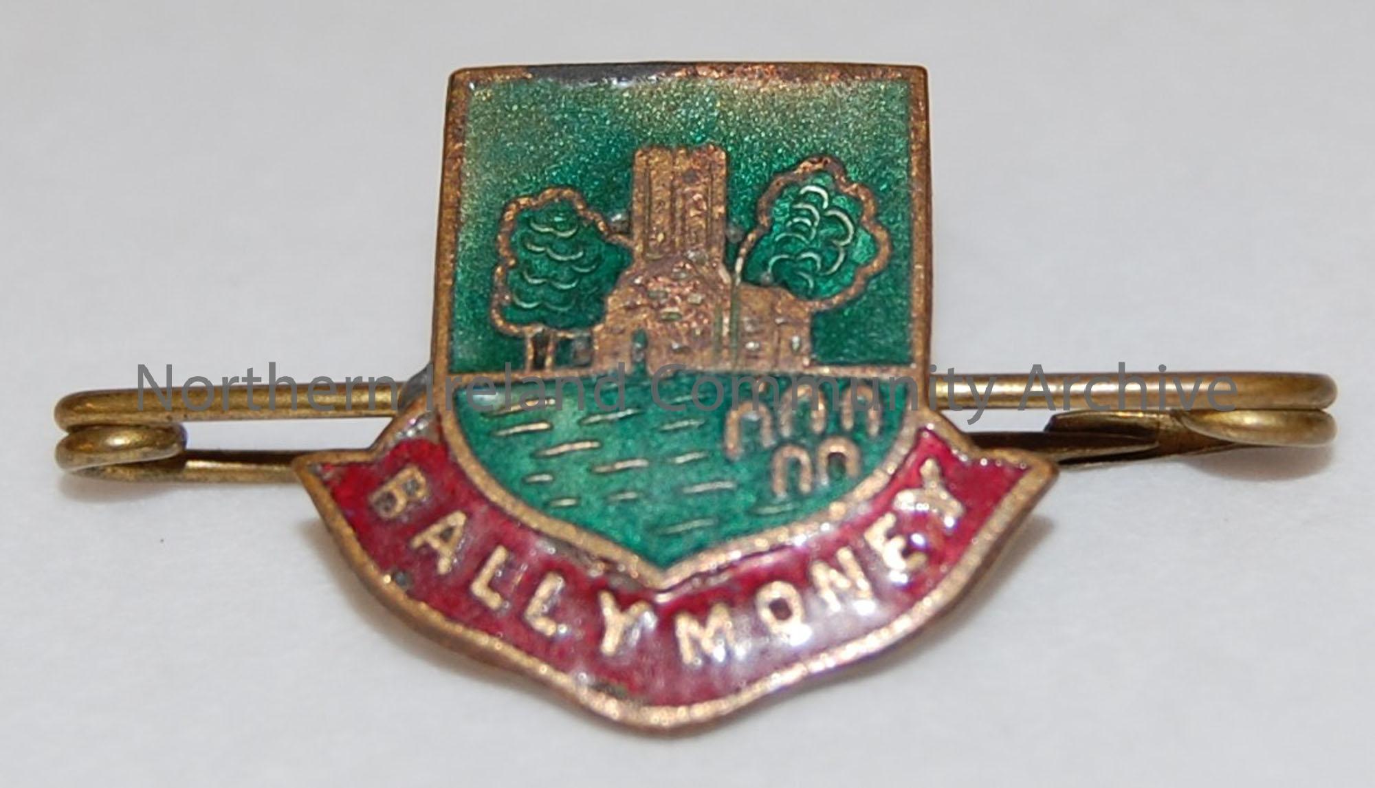 Souvenir badge of Ballymoney with image of the Old Church Tower and graveyard.