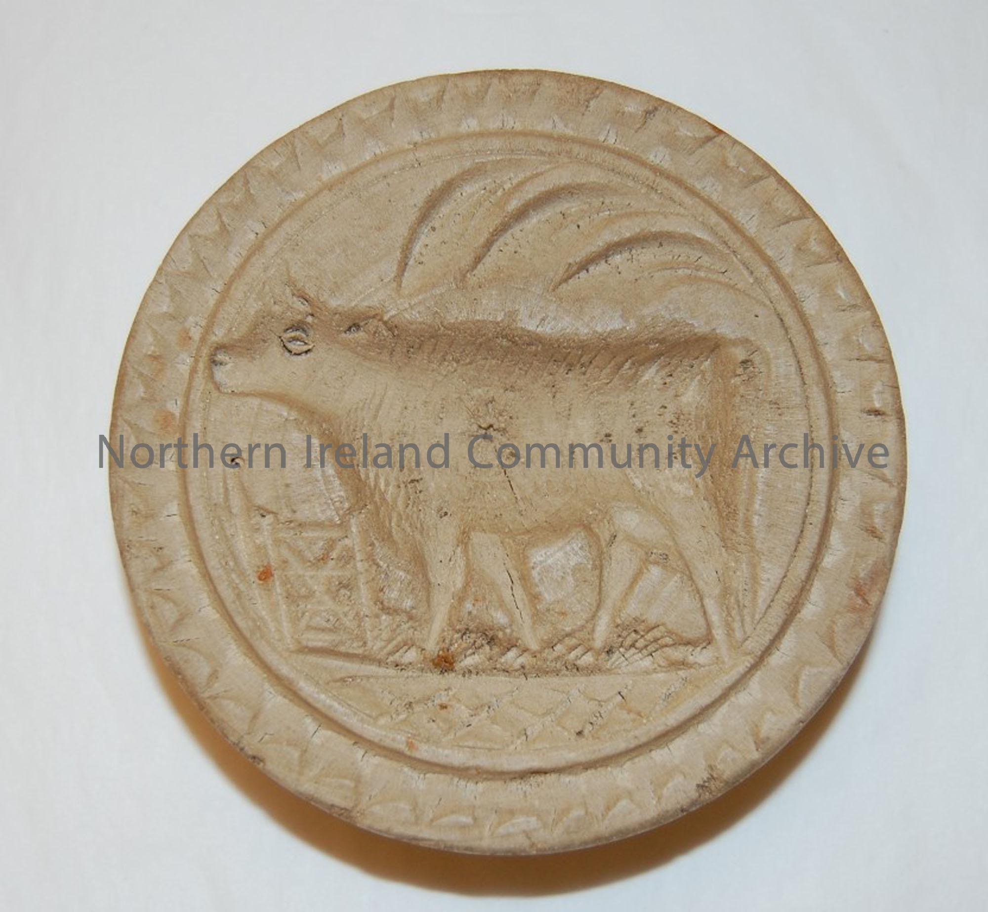 butter stamp imprinted with an image of a cow imprinted, used for pressing butter into shapes