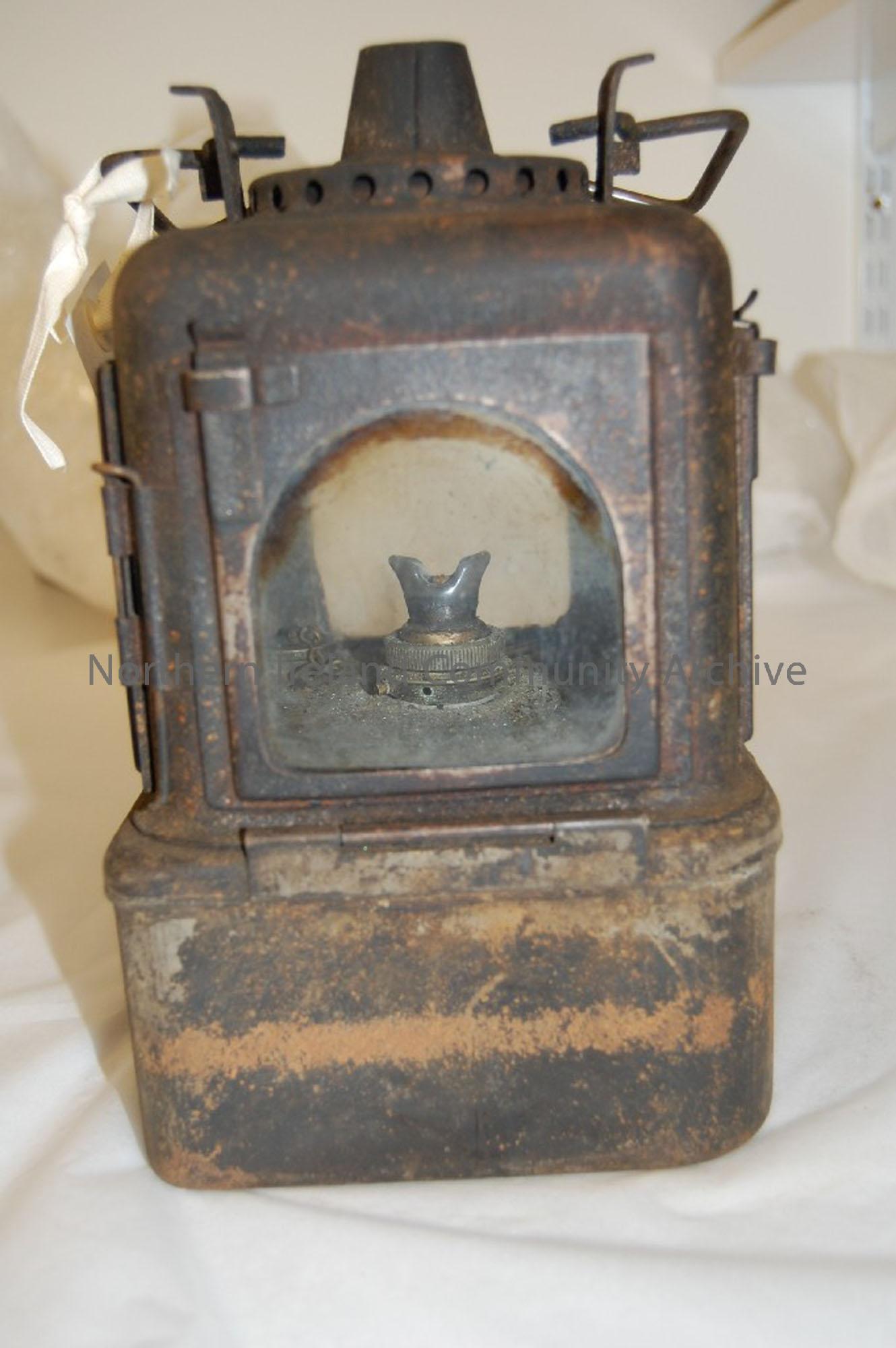 four sided paraffin lamp, with glass intact. Complete, blackened/tarnished by use. Requires restoration.
