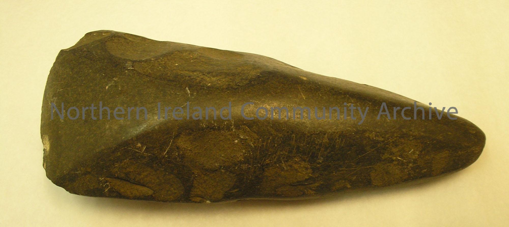 Polished stone axe head, neolithic period