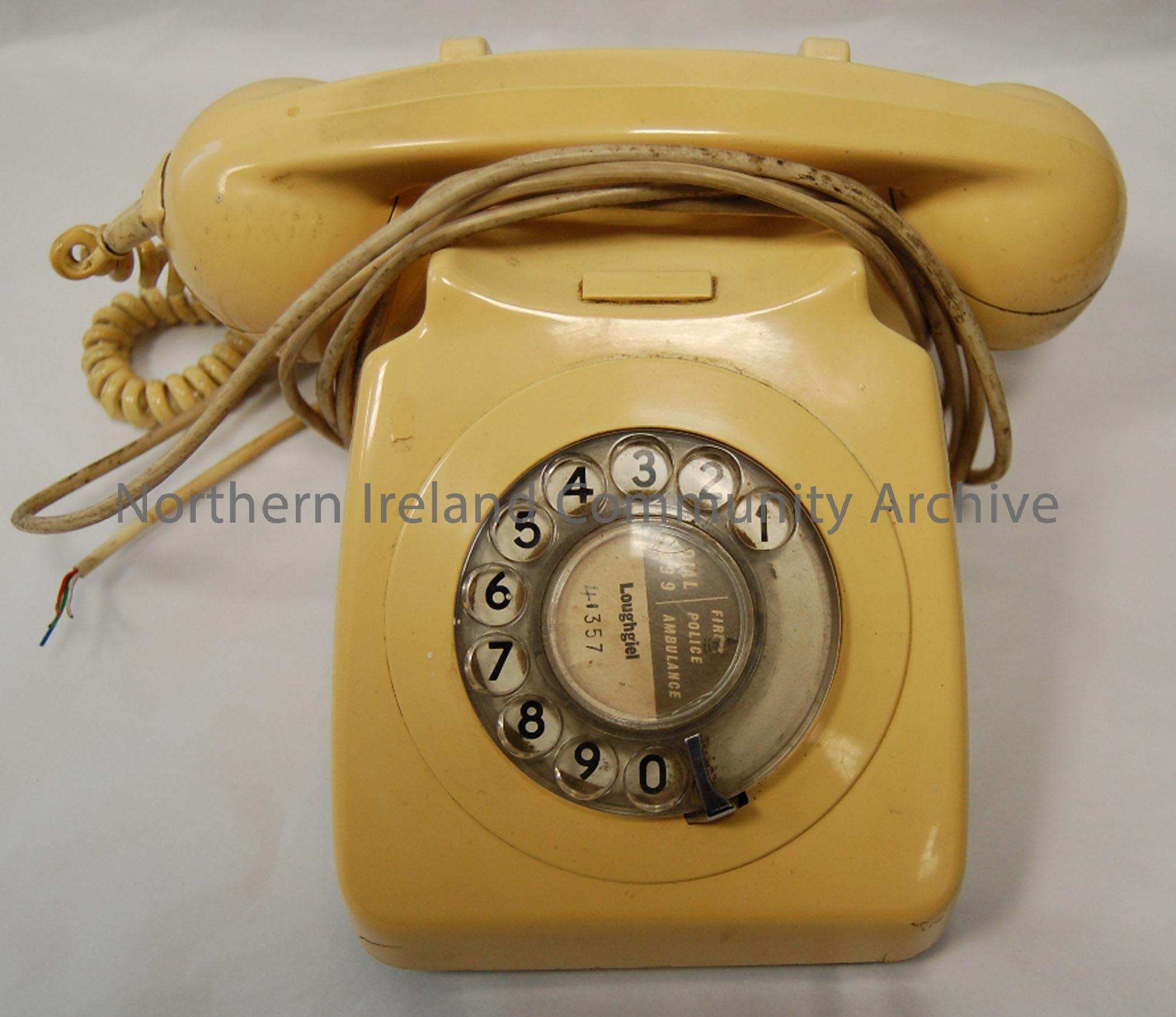 Cream telephone with finger dial