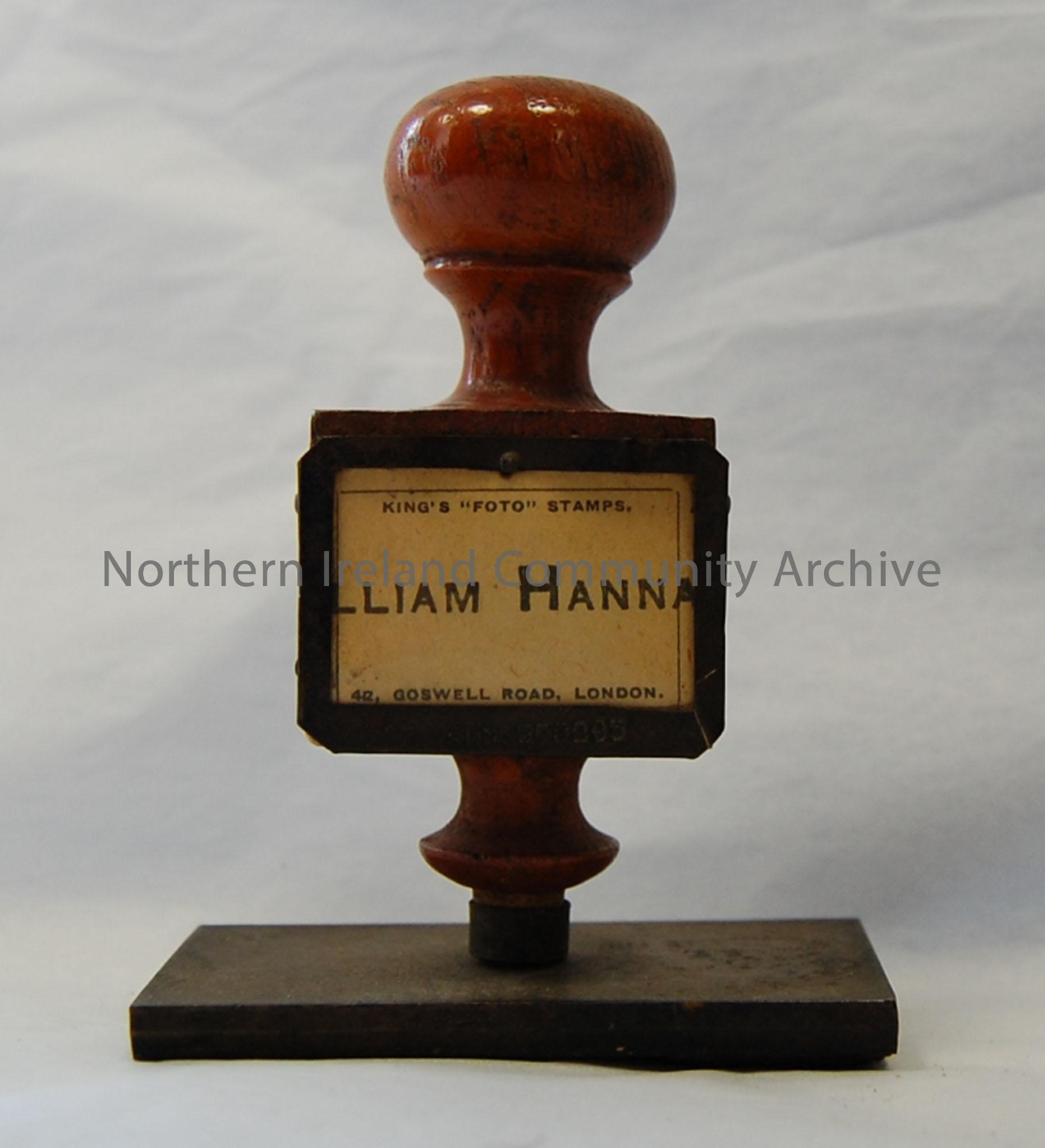 William Hannah rubber stamp with wooden handle with small plaque.