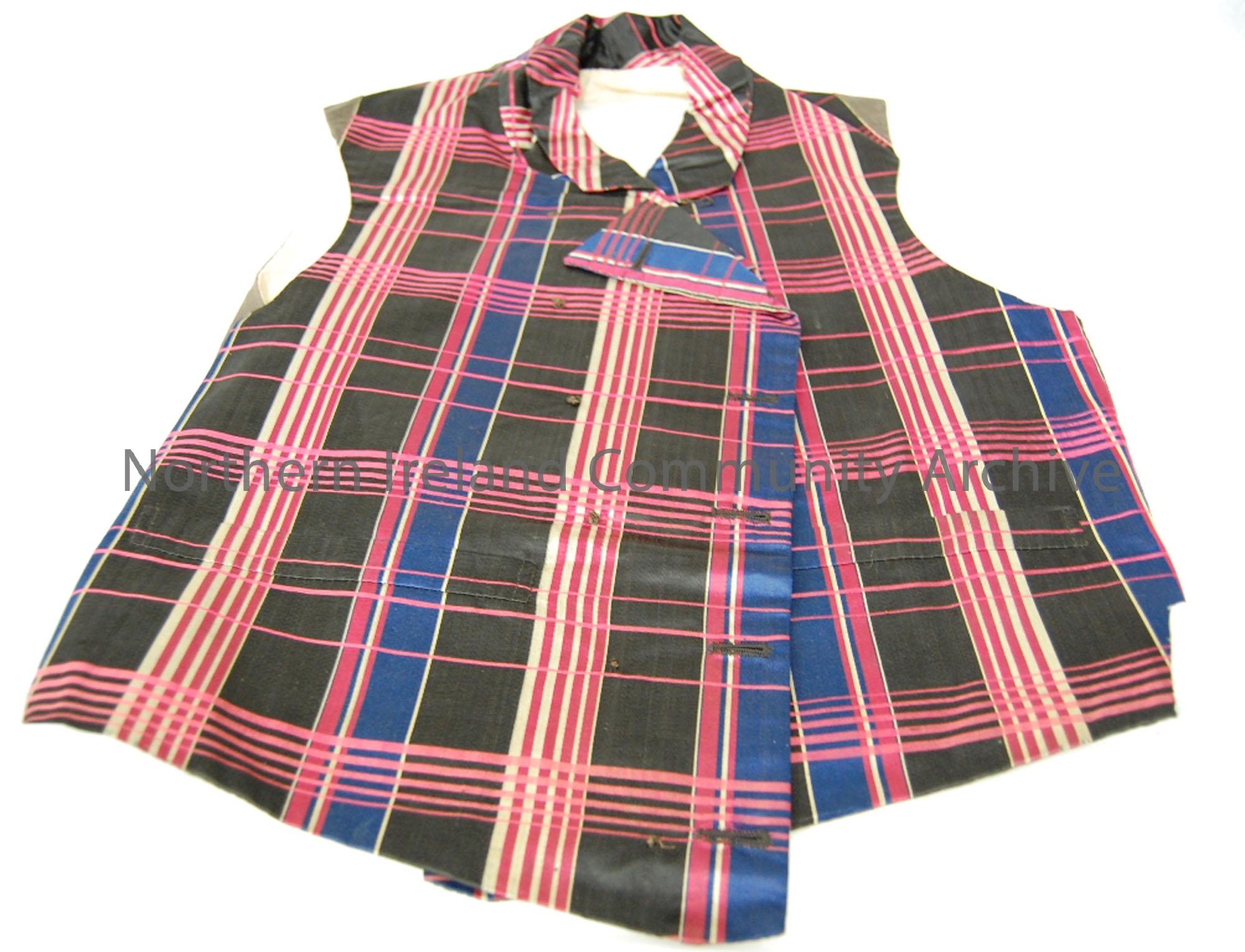 Haul’s waistcoat, over 100 years. Blue, pink, gold and black.