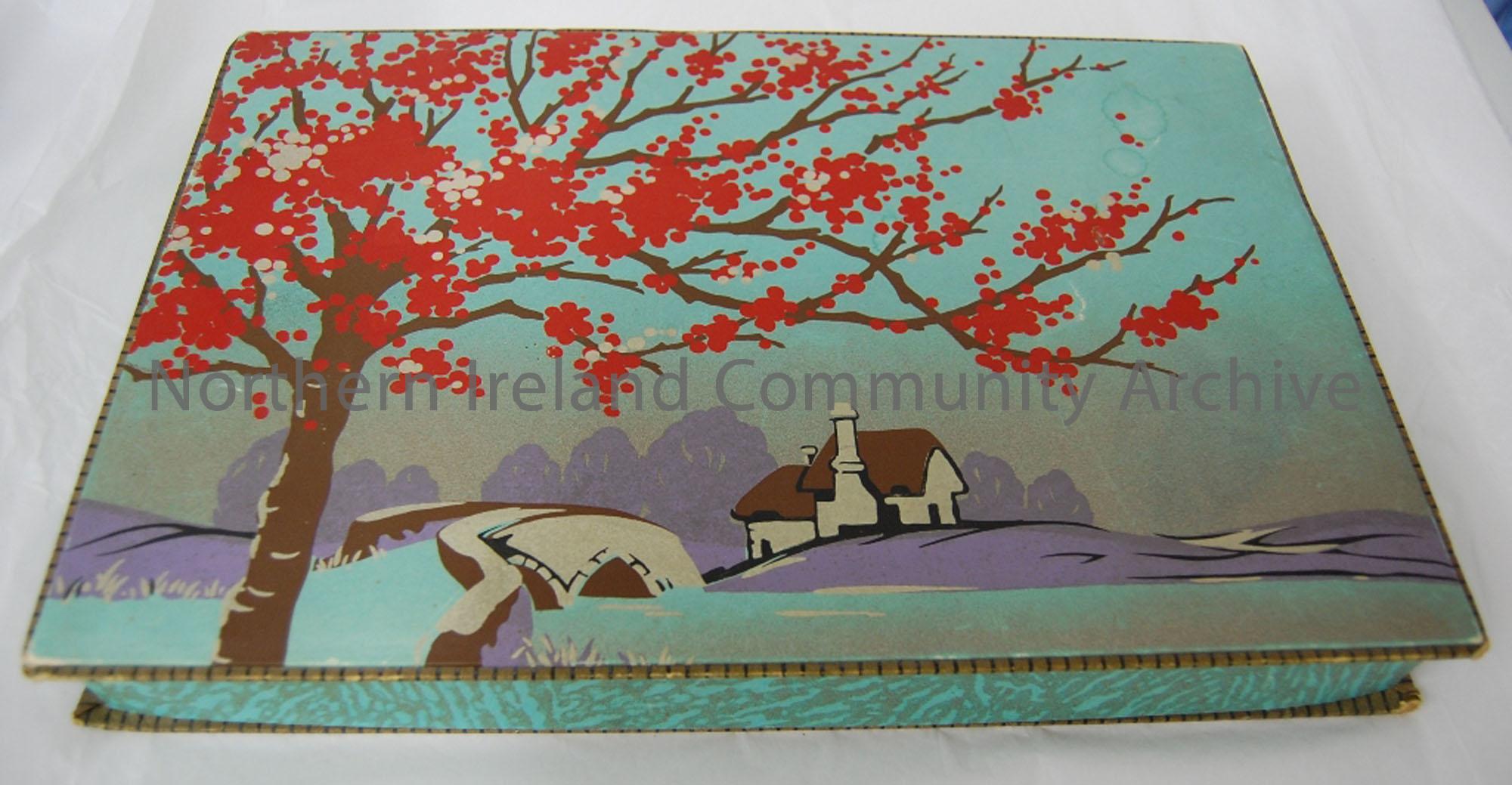 Chocolate Box- rectangle with a lanscape picture of a large tree, a bridge and a house on the padded lid.