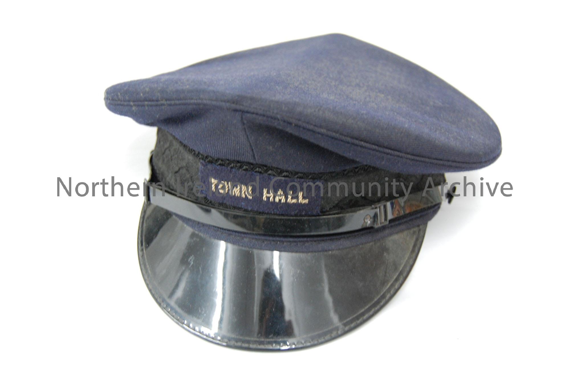 Navy Town Hall cap worn by town hall caretaker