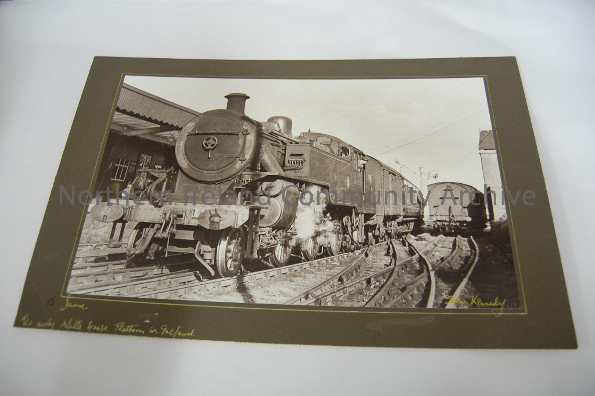 Mounted photograph of the dual gauage track layout at Larne Harbour, the only location in Ireland. No. 10, 2.6.0 Tank engine with train for Belfast- S…