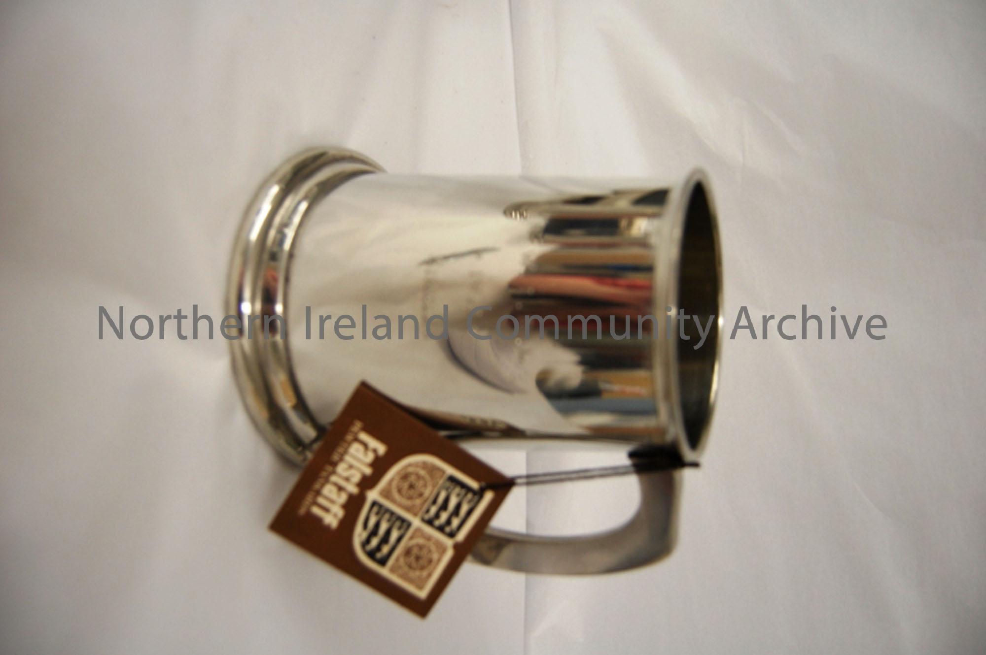 pewter tankard with handle on right side. Inscribed N.W.I.B.L 1971 singles. has original tag on it which gives instructions on how to care for the tan…