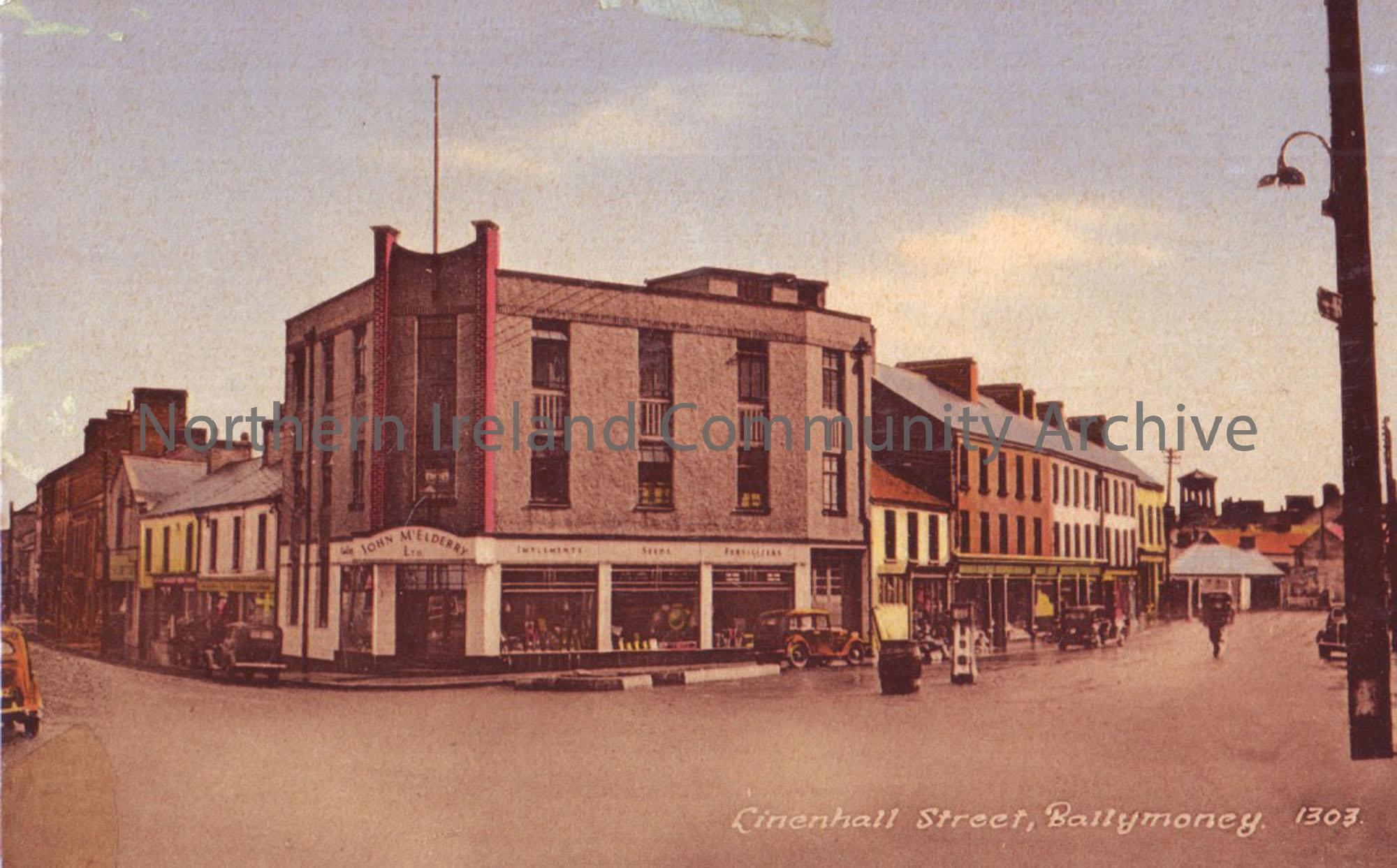 Postcard with a photograph of Linenhall street, Ballymoney. John McElderry LTD can be seen in the photograph