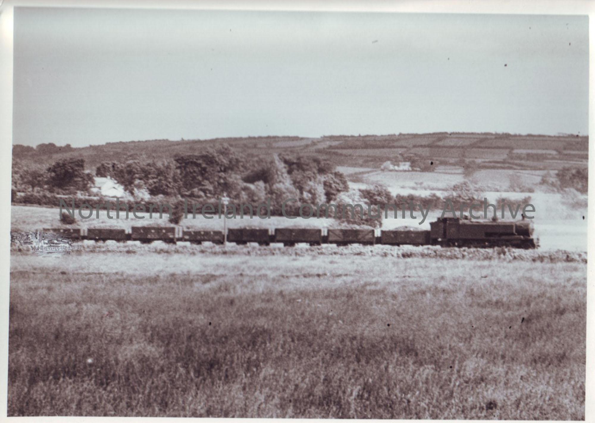 Photograph of coal train near Ballyboley junction in 1940. The line to Ballymena was still in operation for goods only. The train is hauled by ex Ball…