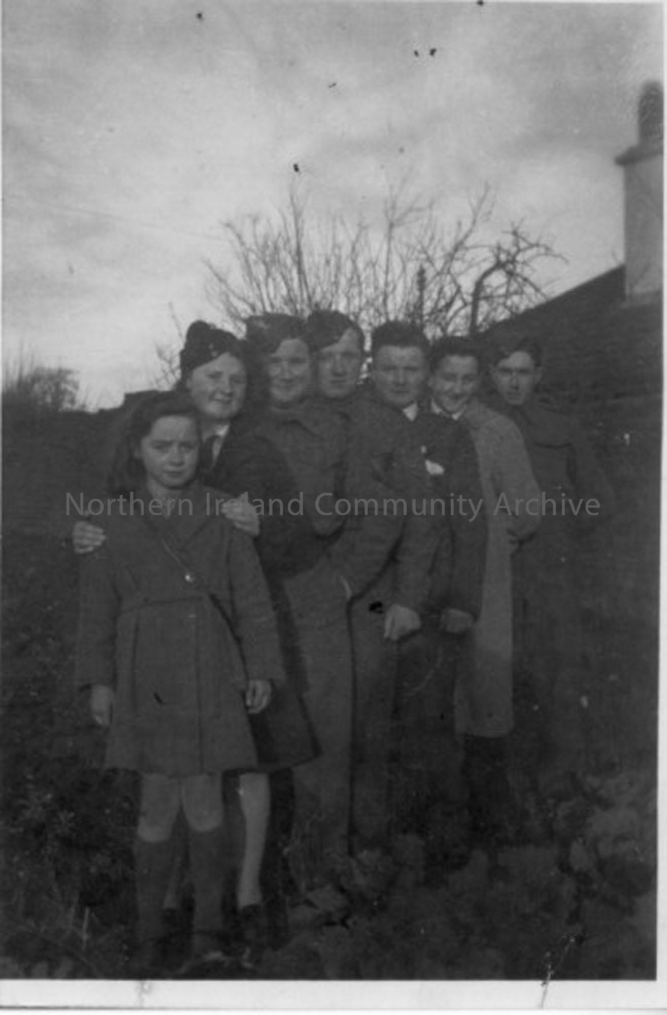 Black and white photograph of Fred Dunlop (donor) with family in garden 57? Charlotte Street, Ballymoney. c.1944-45