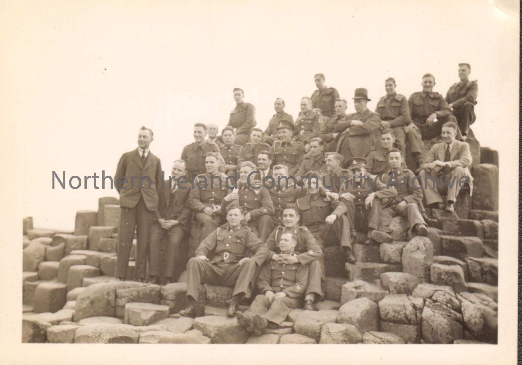 Black and white photograph of a group of soldiers at the Giant’s Causeway