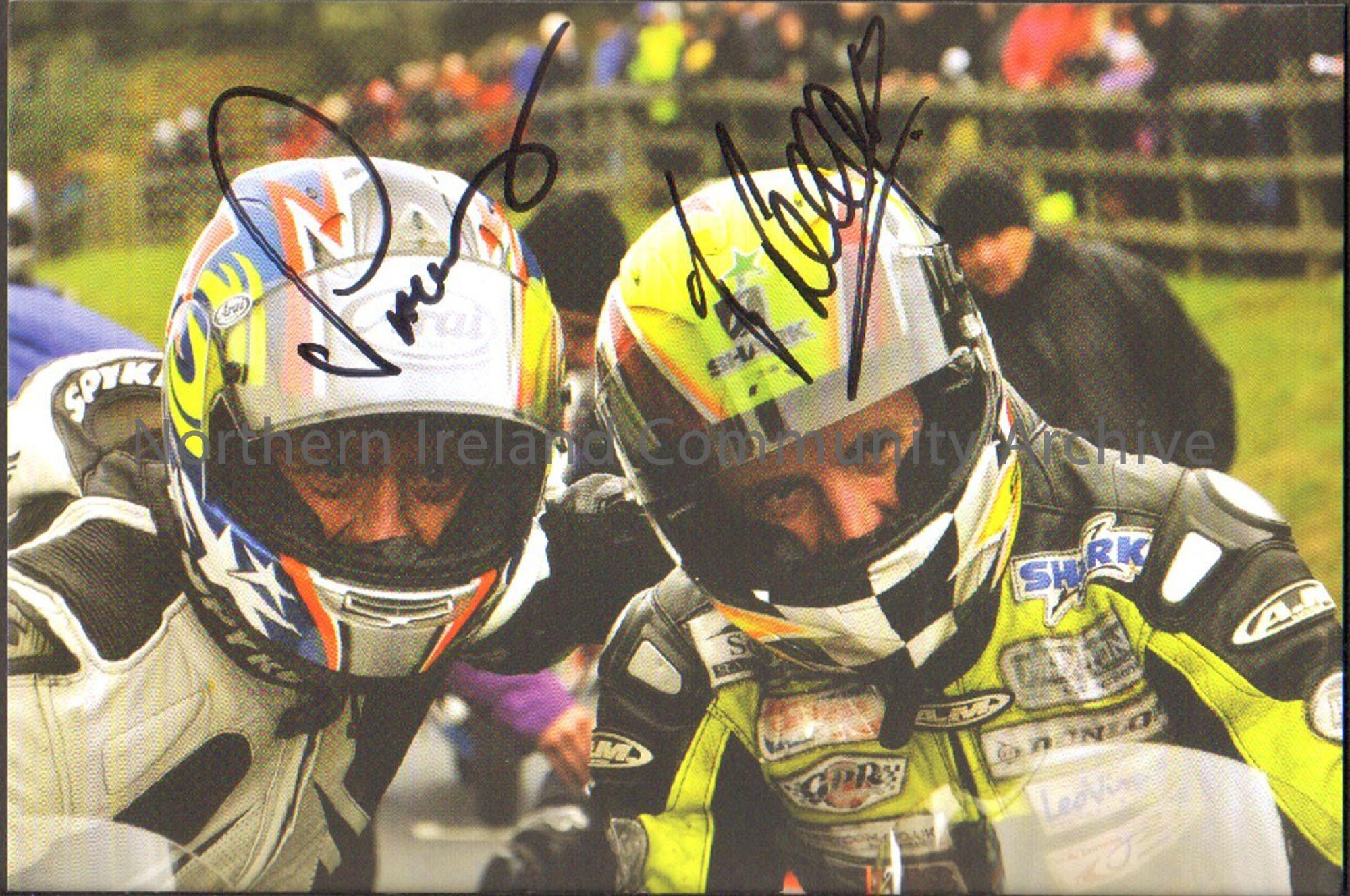 Signed photograph of Chris Palmer wearing white and black leathers with Ian Lougher wearing black and luminous green leathers. Both are wearing helmet…