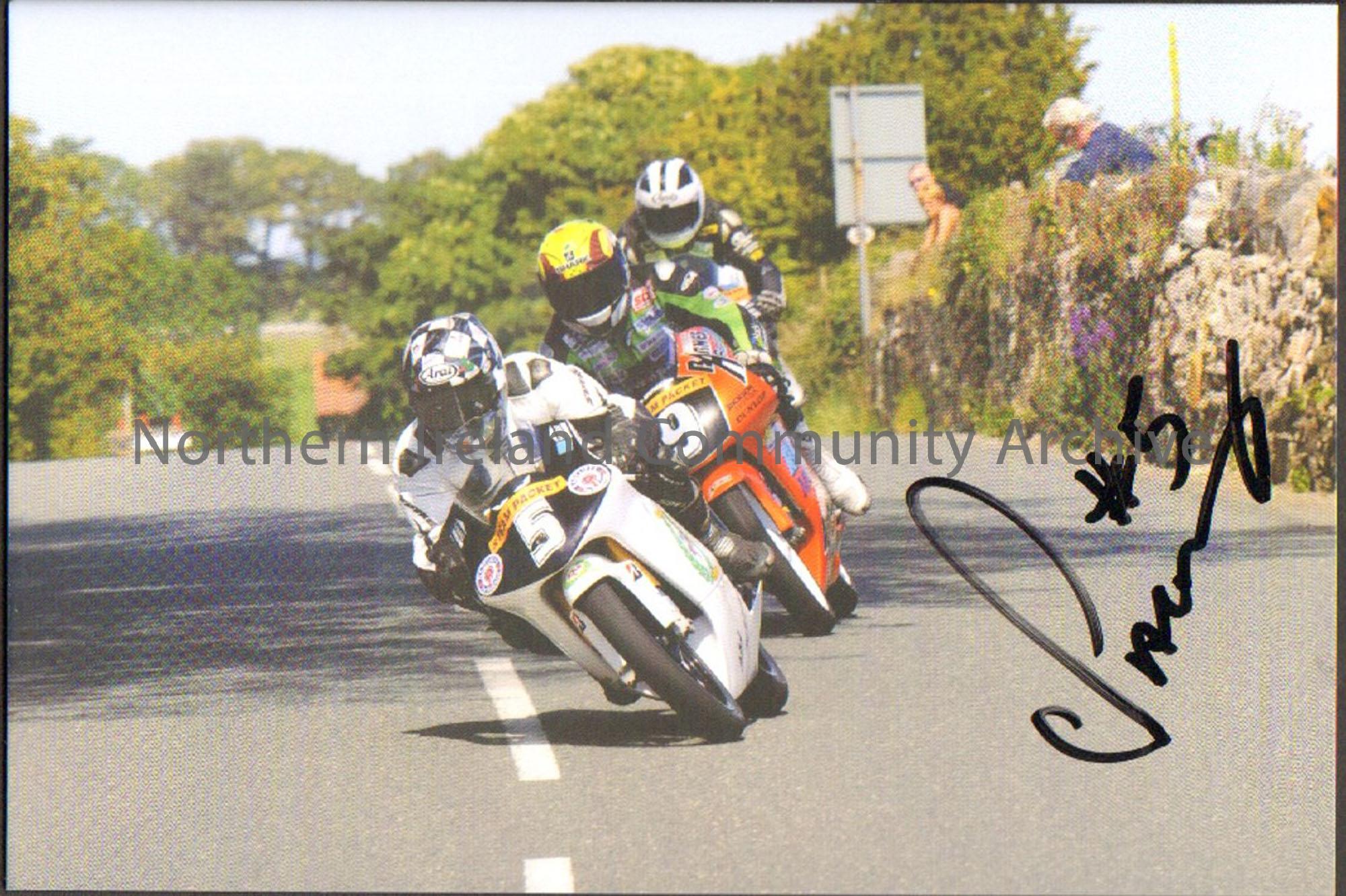 Signed photograph of Chris Palmer riding a black and white motorbike with number 5 on the front followed by Ian Lougher on a red bike with 9 on the fr…